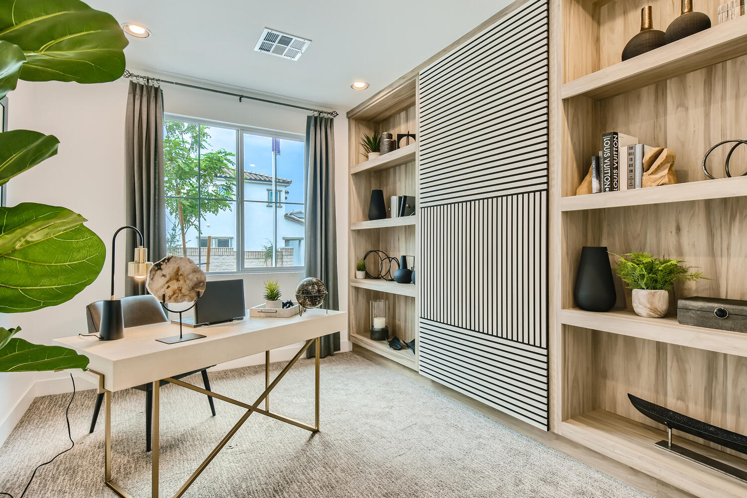 A room with a table and shelves.