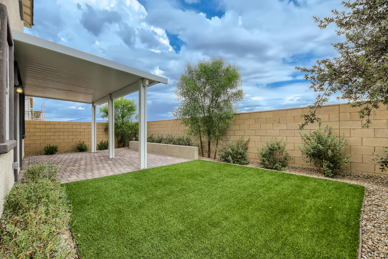 A building with a green lawn.