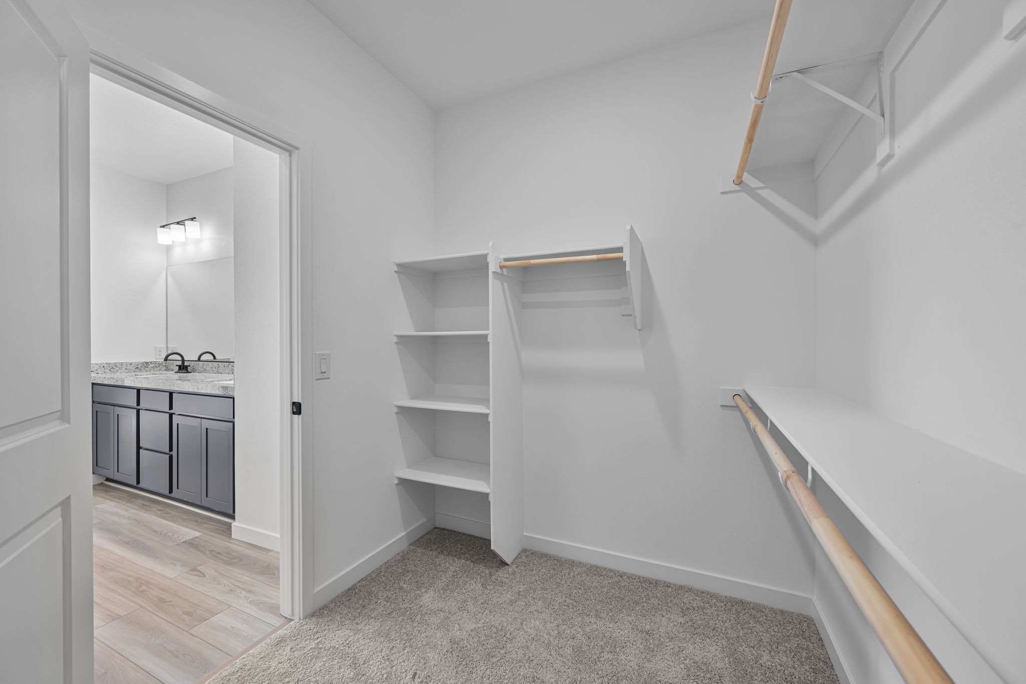 A white room with a glass door.