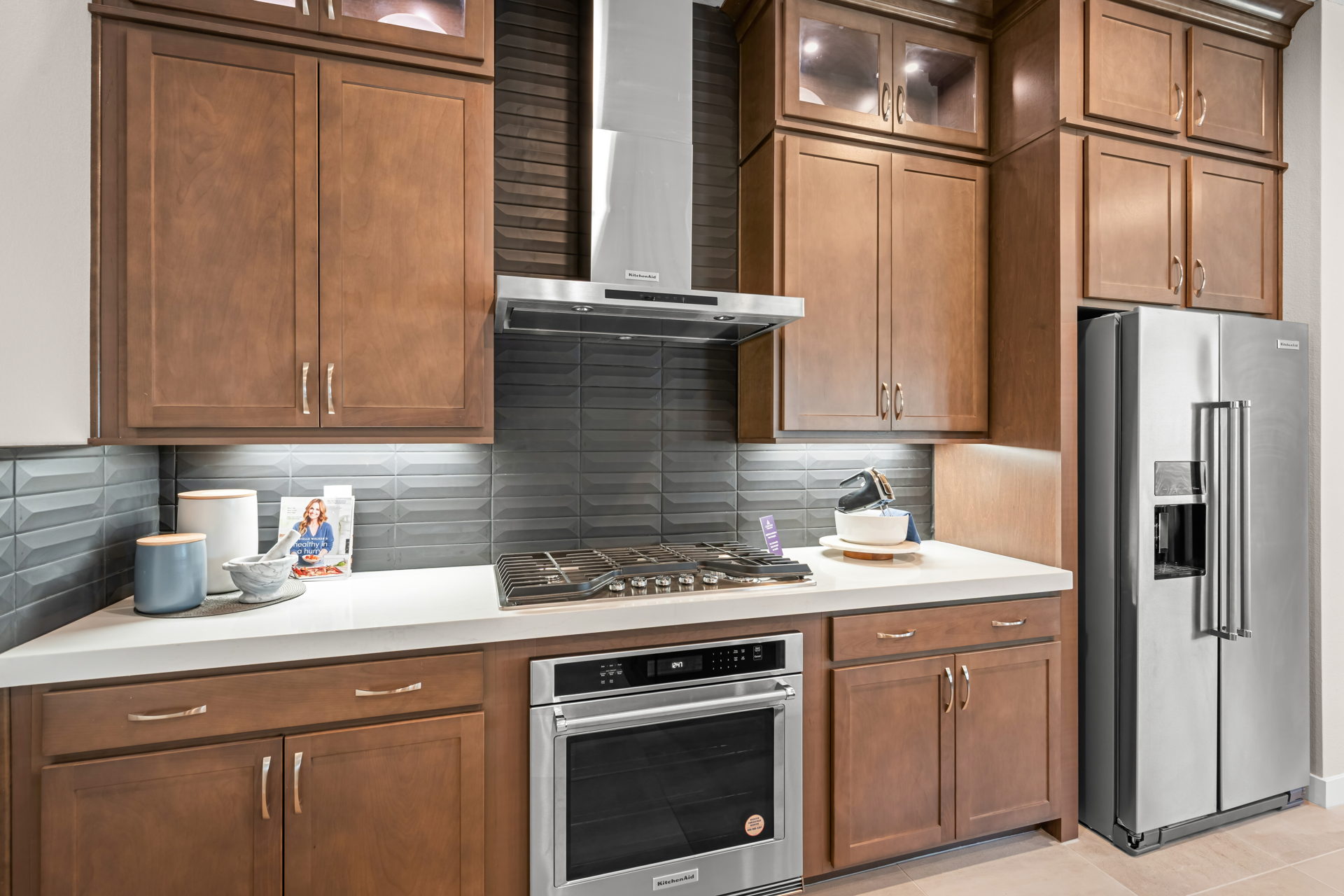 A kitchen with wooden cabinets.