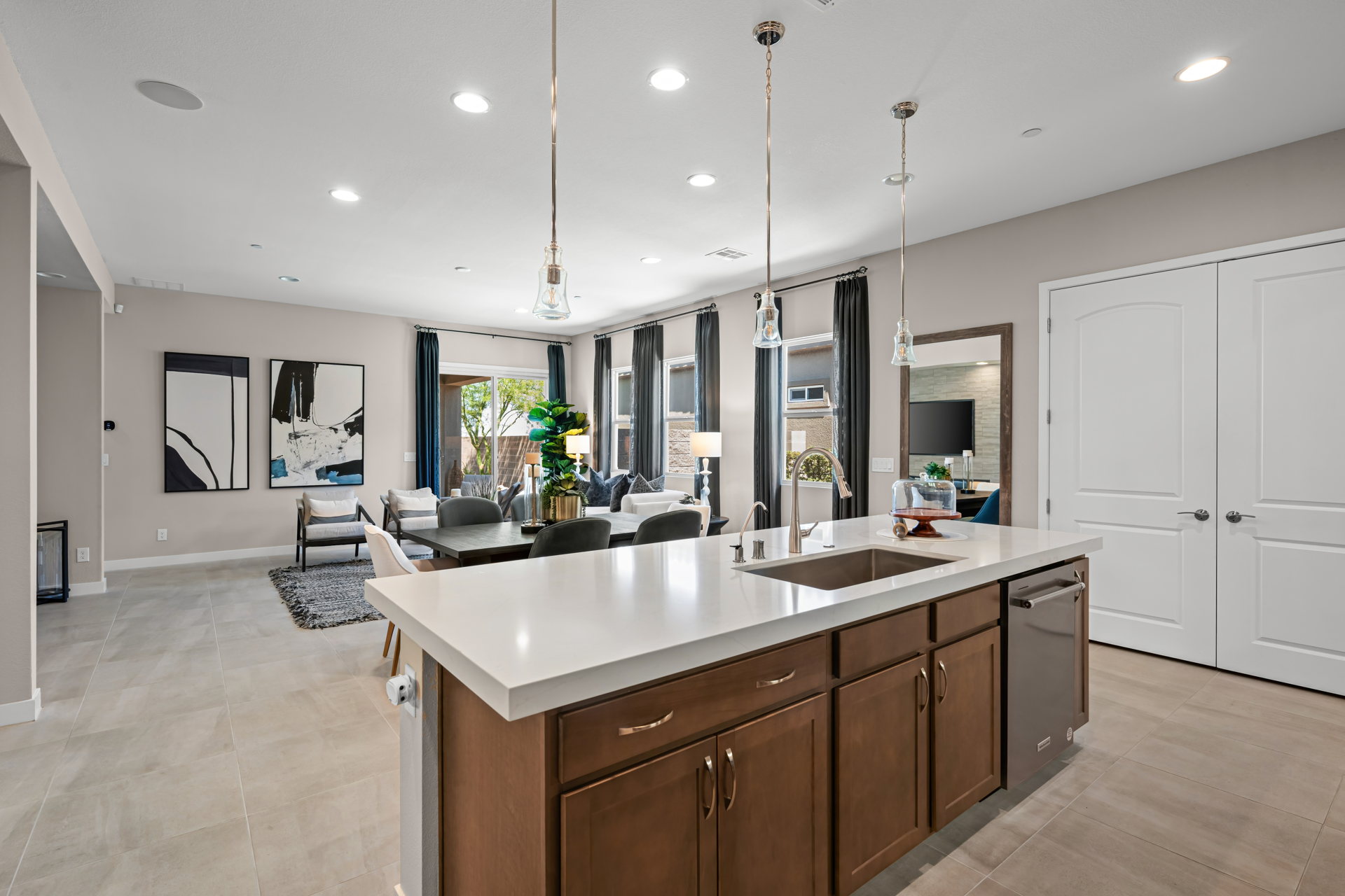 A kitchen with a marble island.
