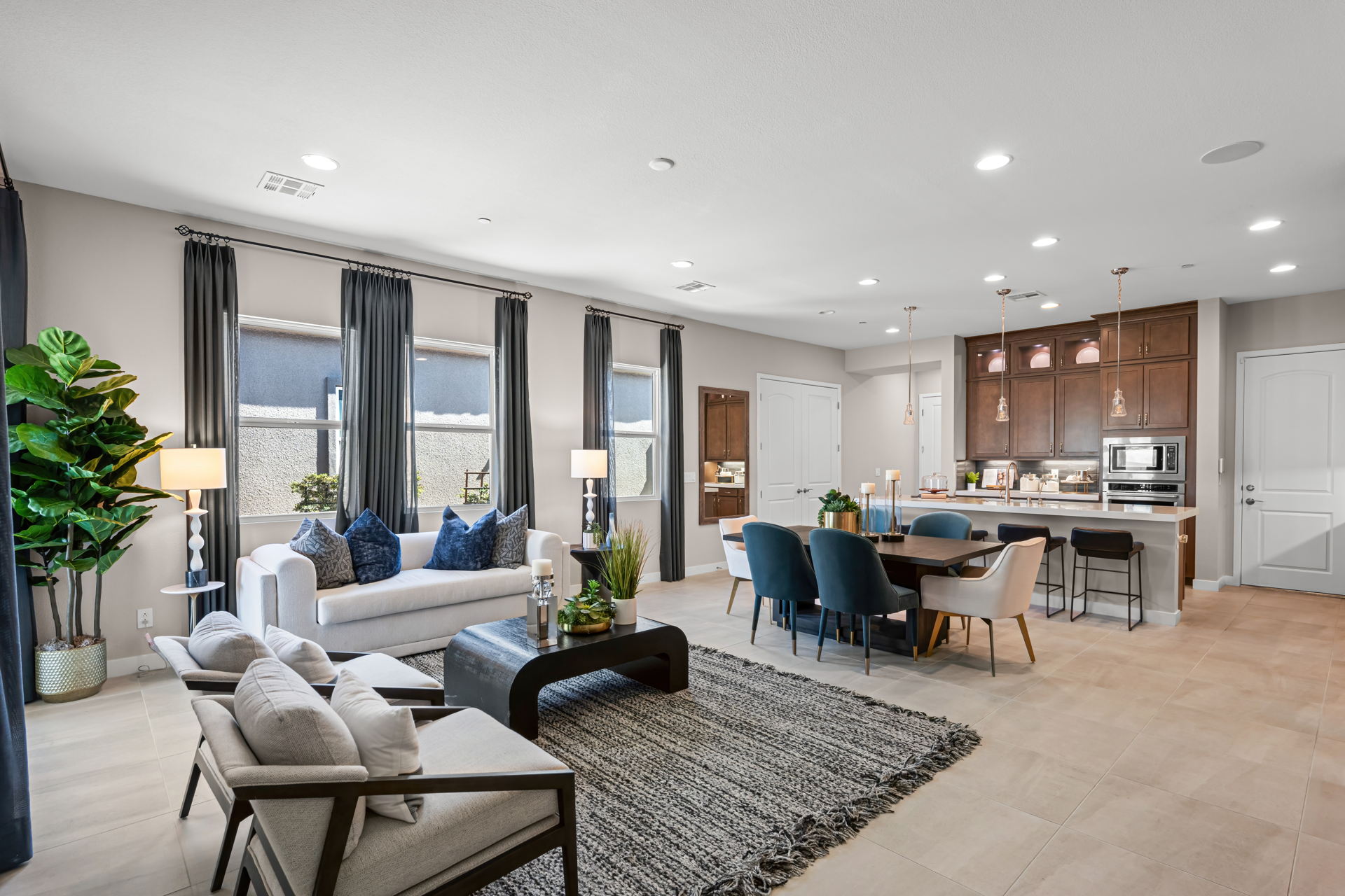 A large living room with a large kitchen and dining area.