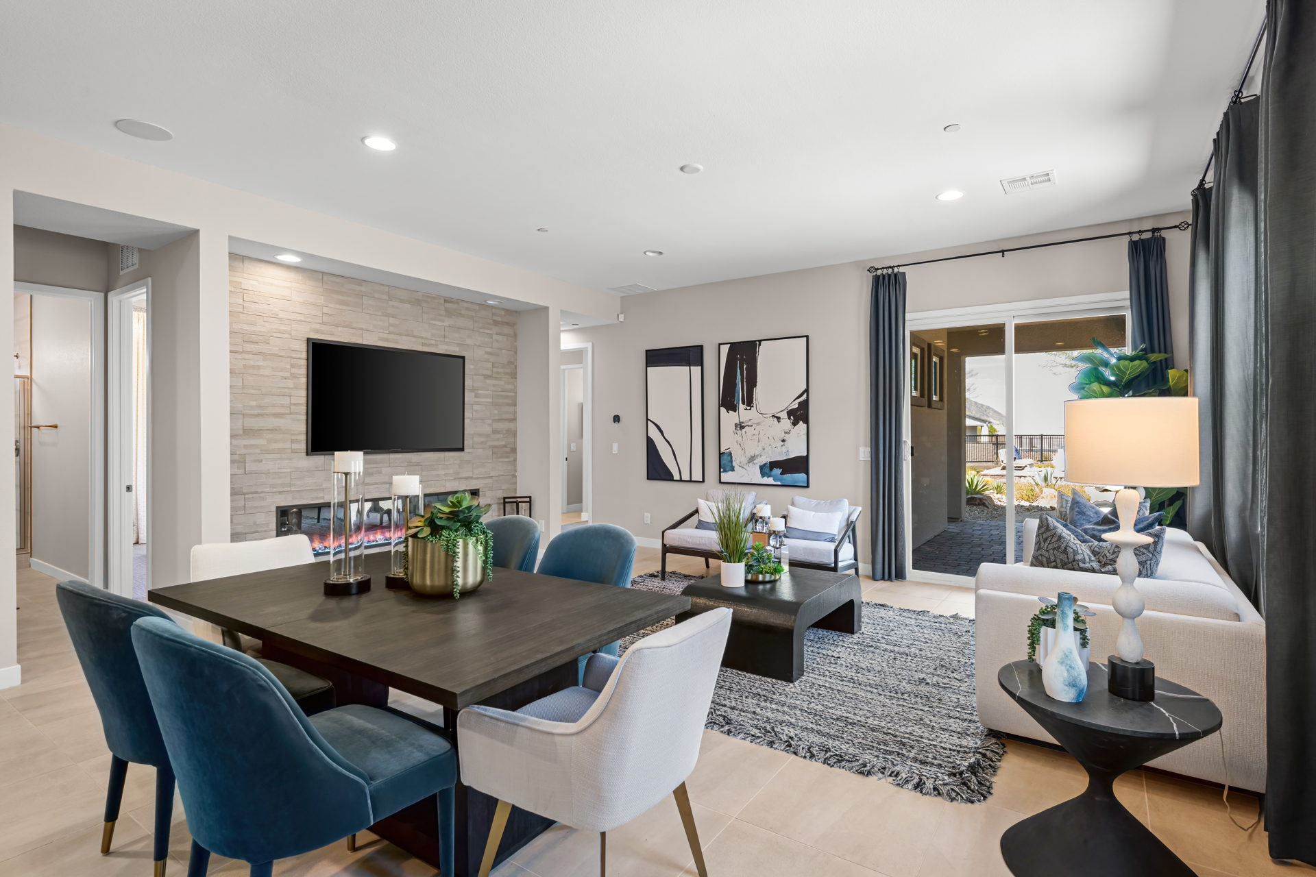 A living room with a tv and chairs.