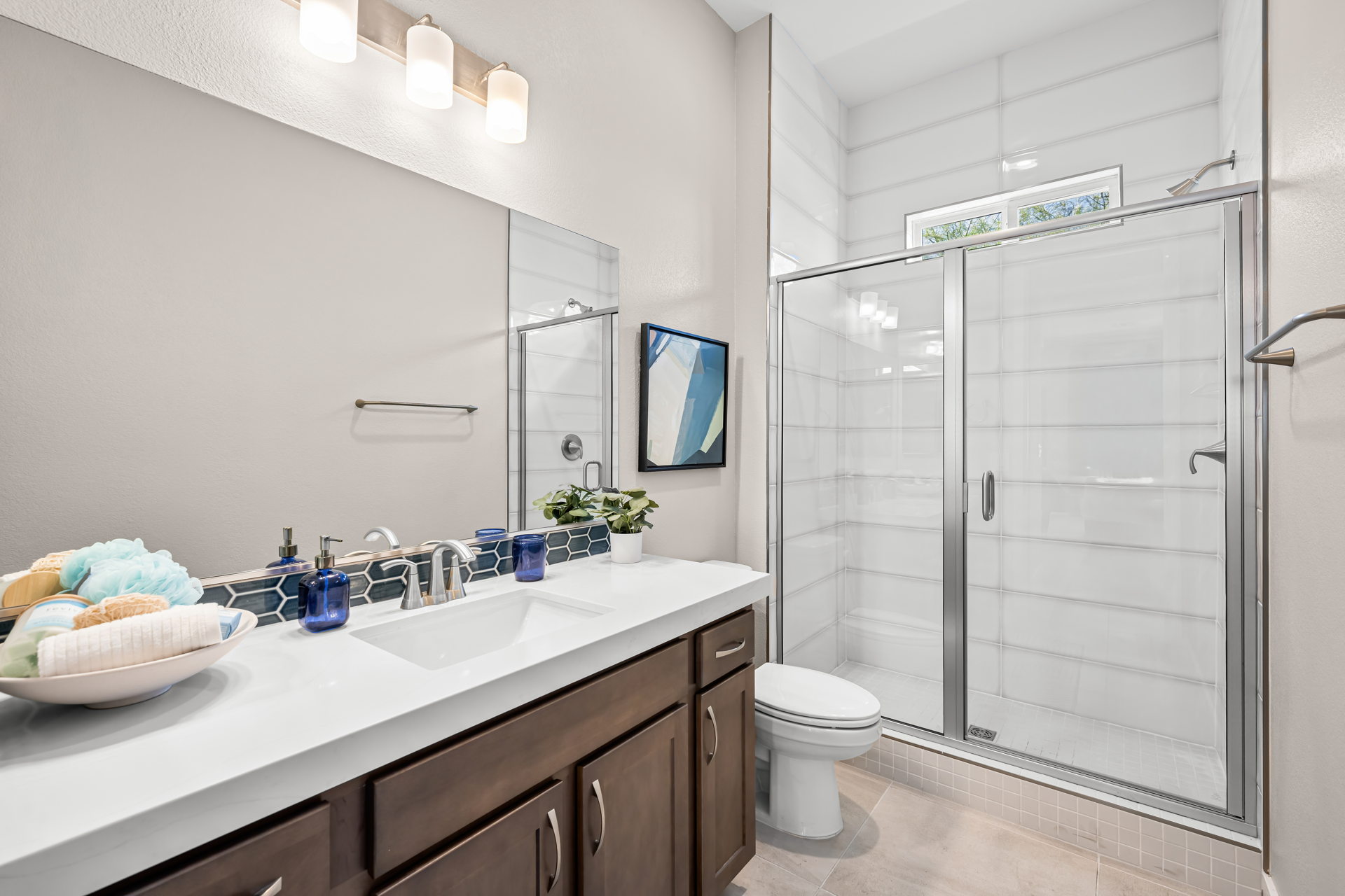 A bathroom with a glass shower.