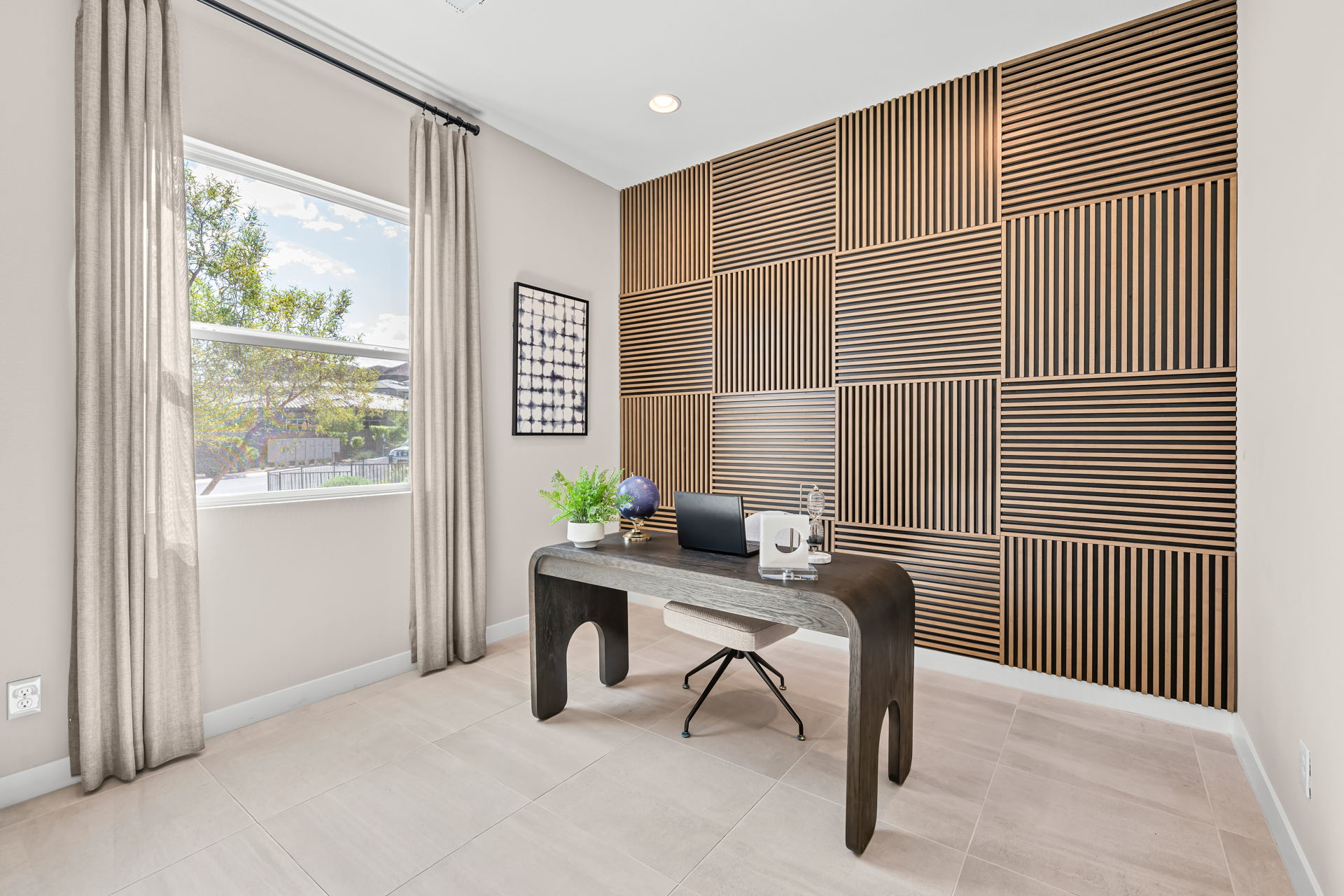 A room with a desk and a computer.