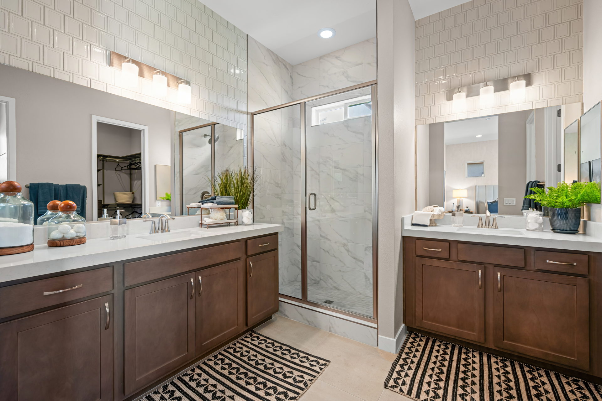 A bathroom with a shower and sink.