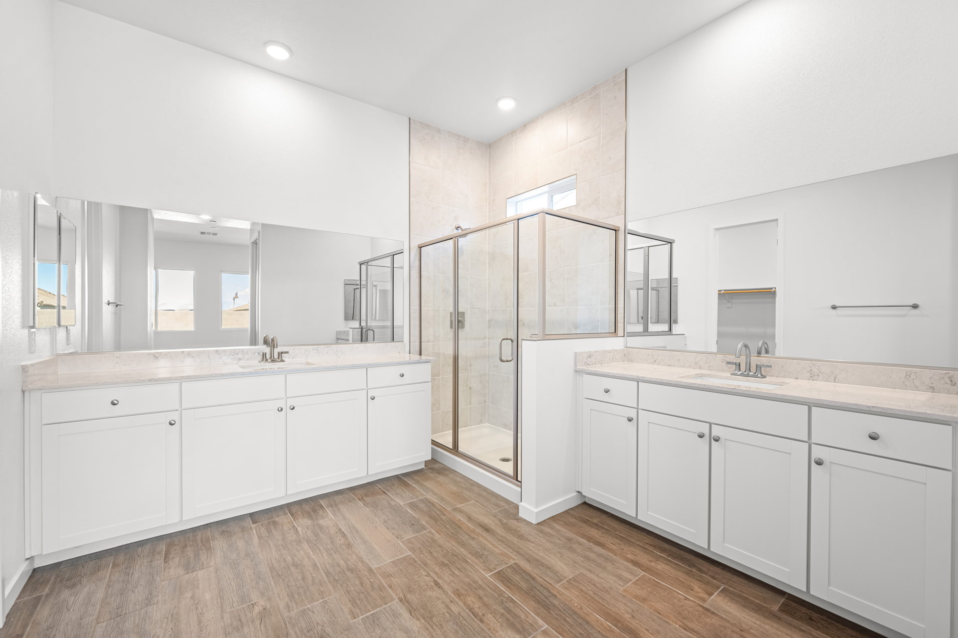 A kitchen with white cabinets.