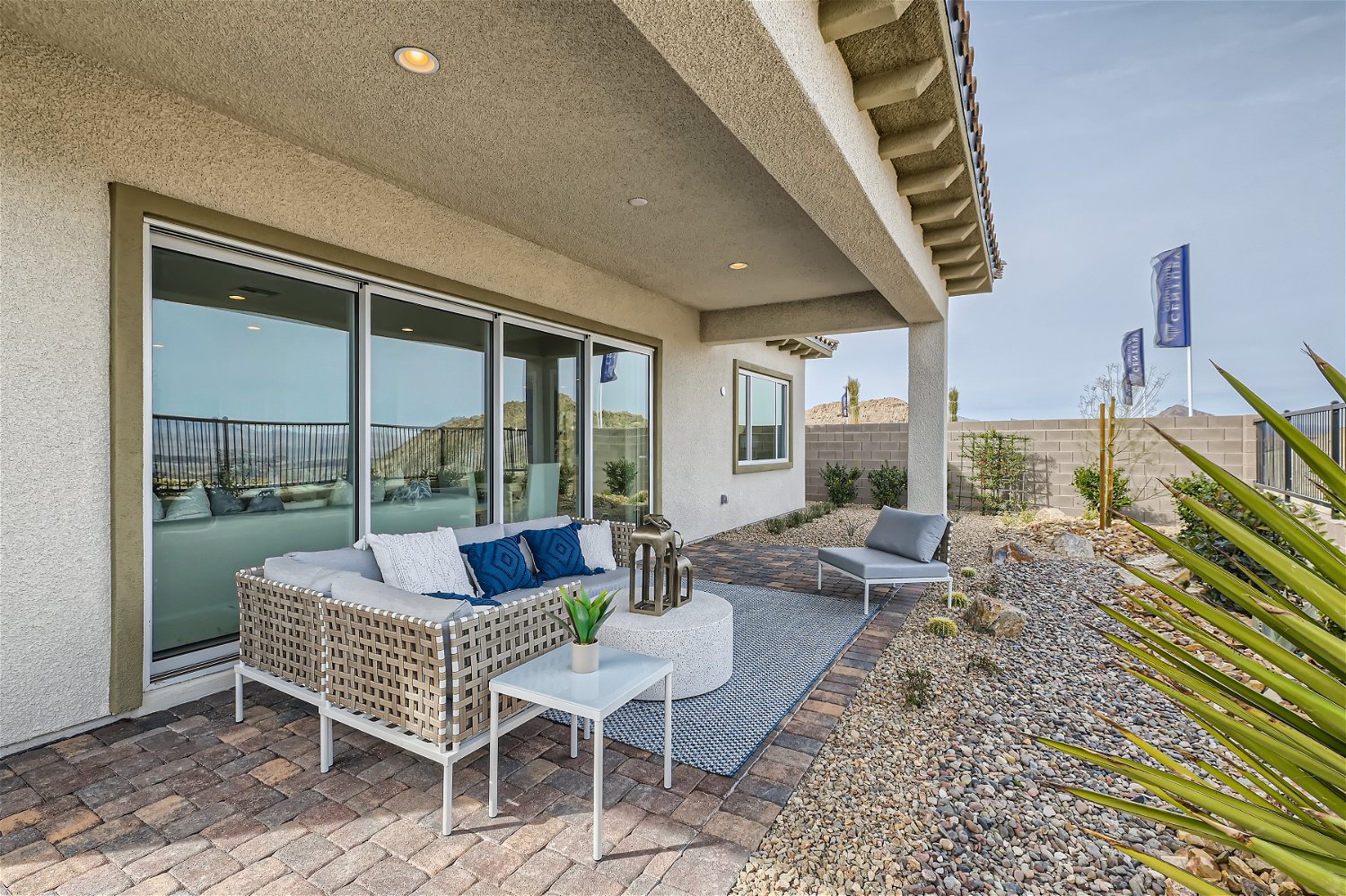 A patio with a table and chairs.
