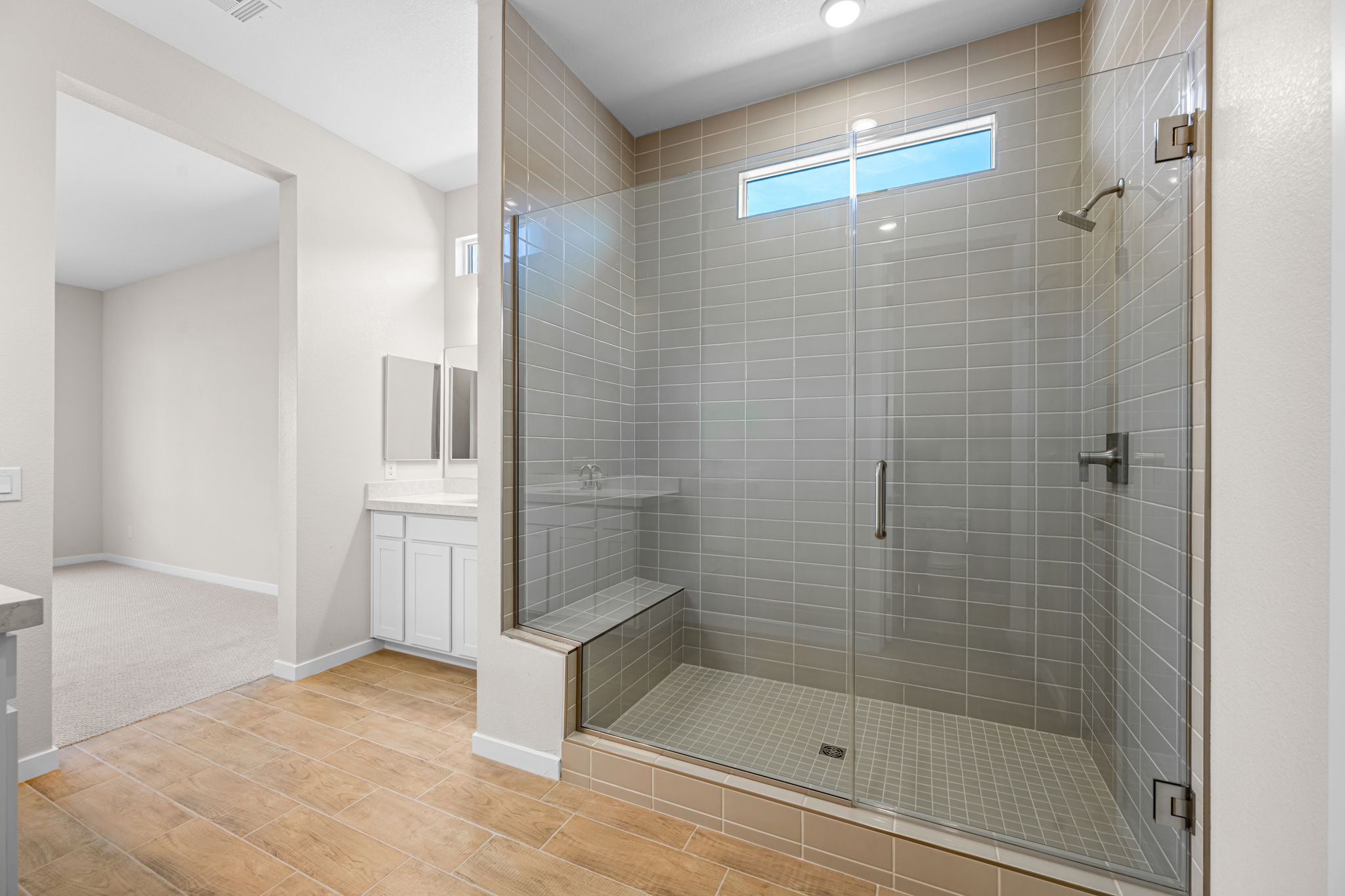 A bathroom with a glass shower.