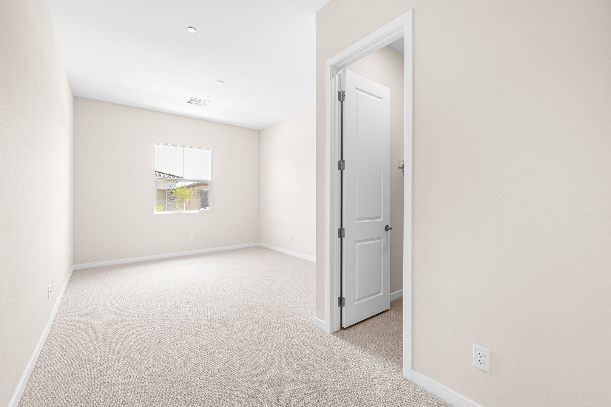 A hallway with white walls.