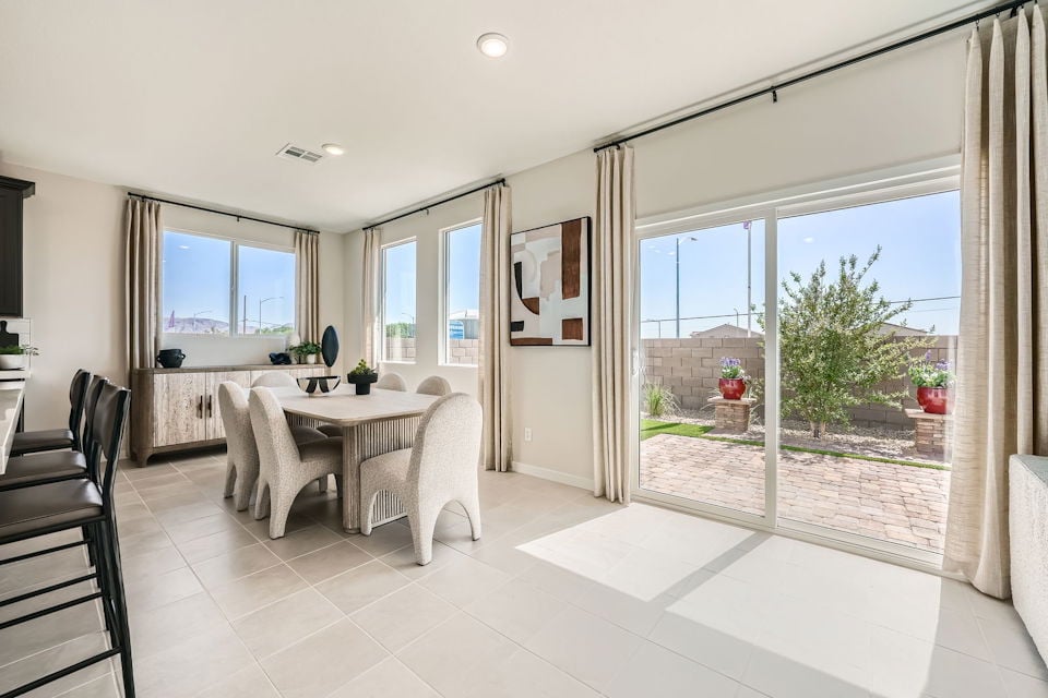 A large room with a table and chairs.