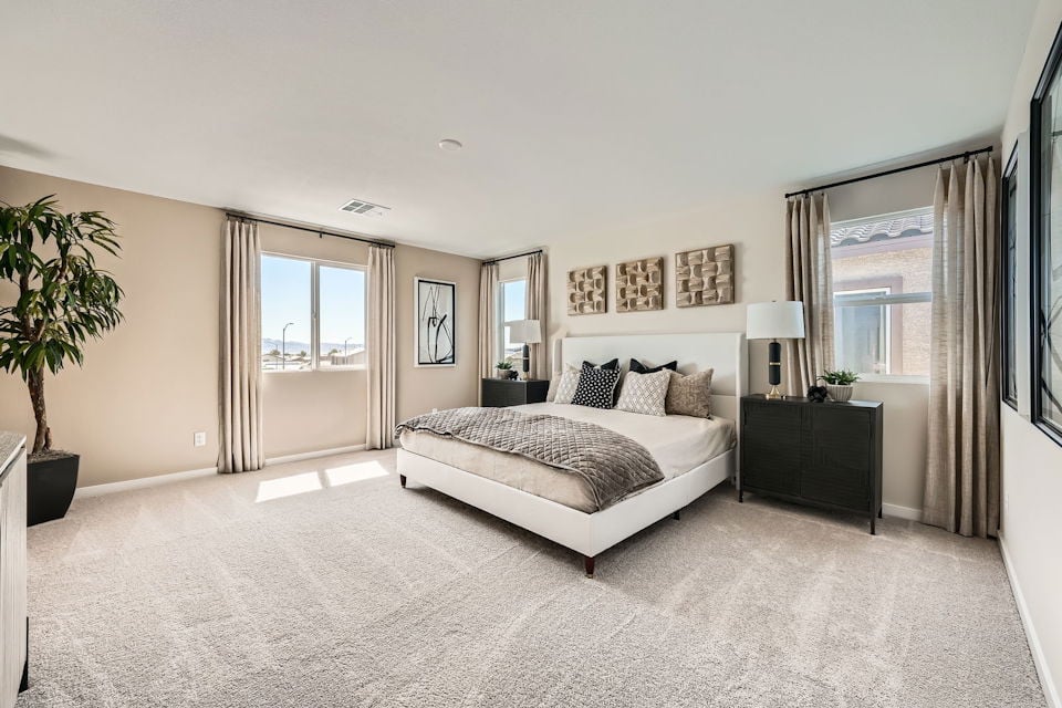 A bedroom with a large bed.