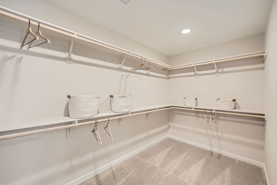 A bathroom with a tub and towels.