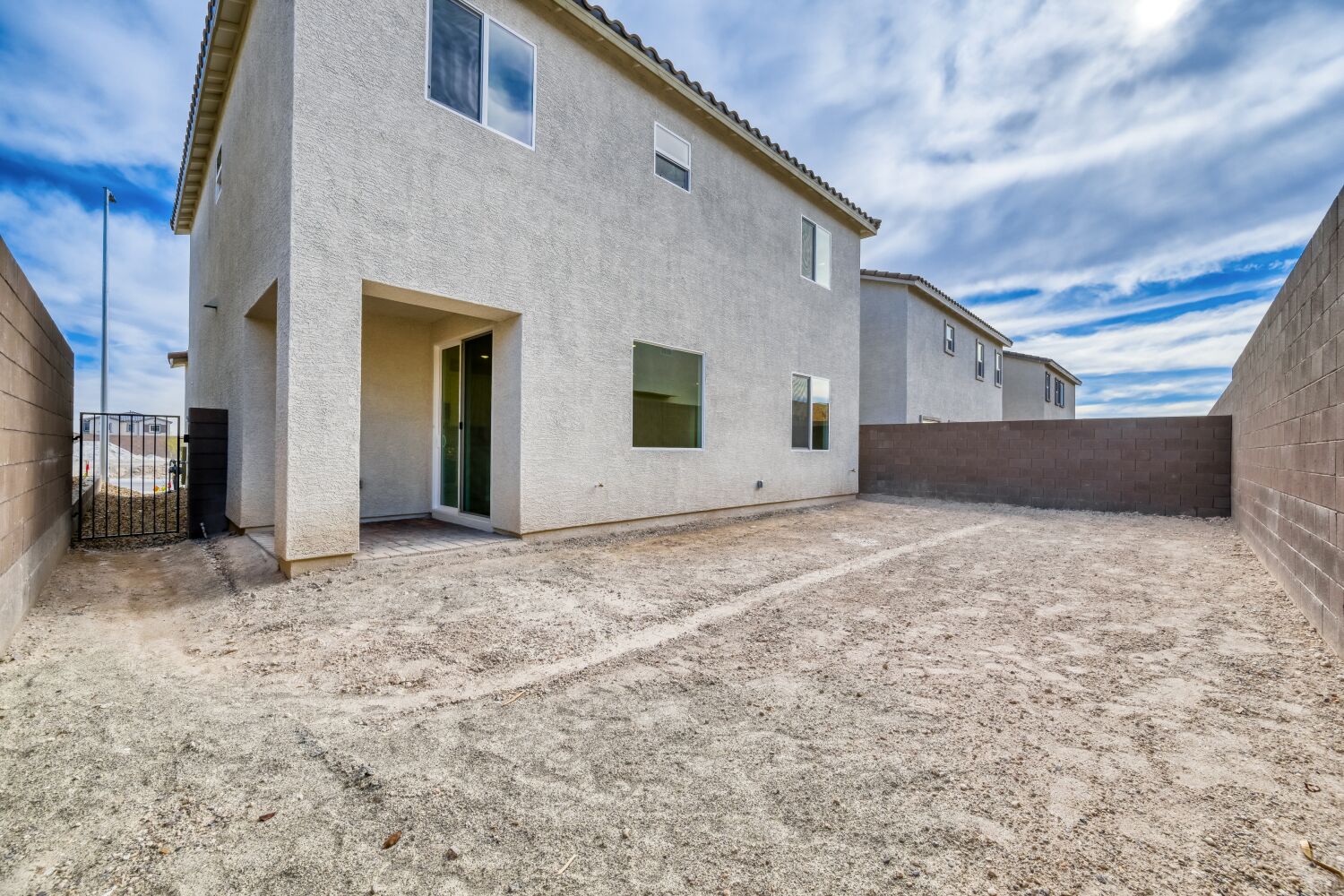 A building with a dirt road.