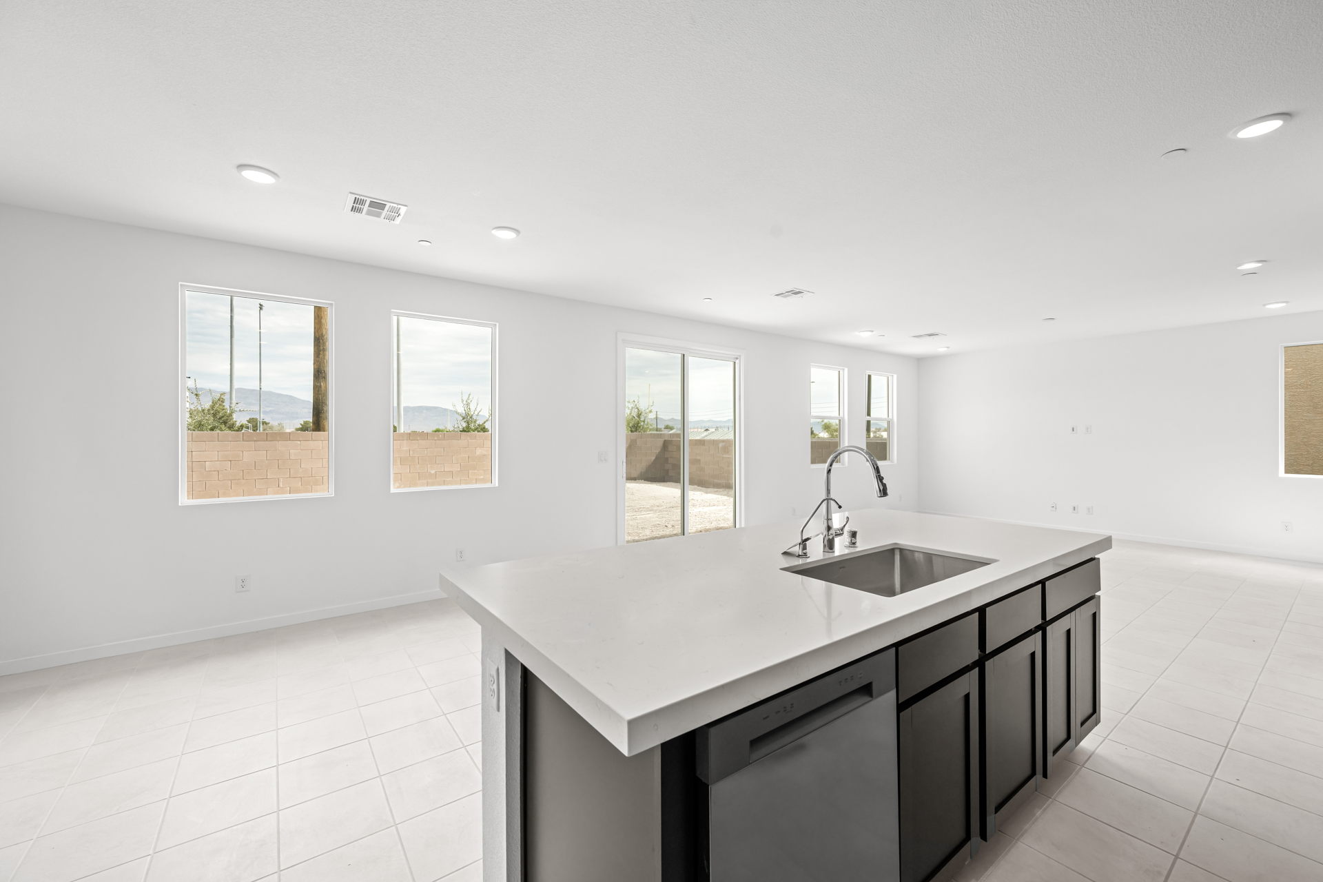 A kitchen with a sink and cabinets.