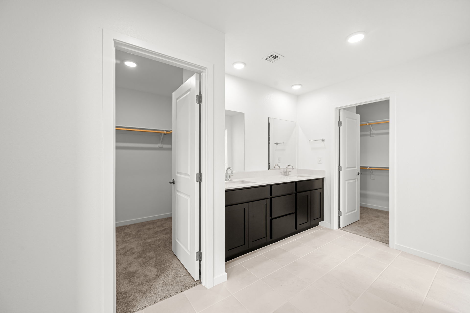 A bathroom with a glass door.