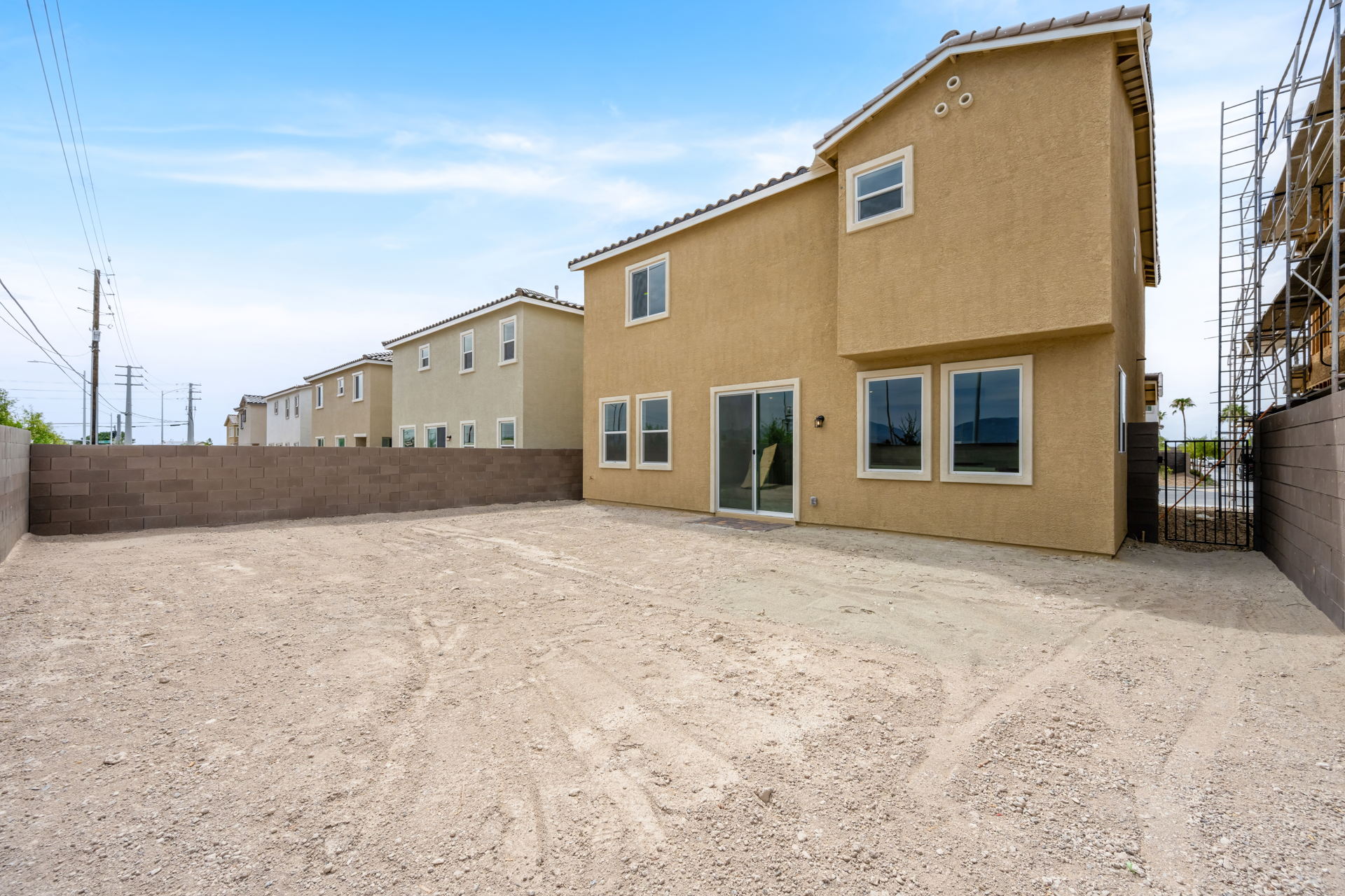 A building with a dirt lot.