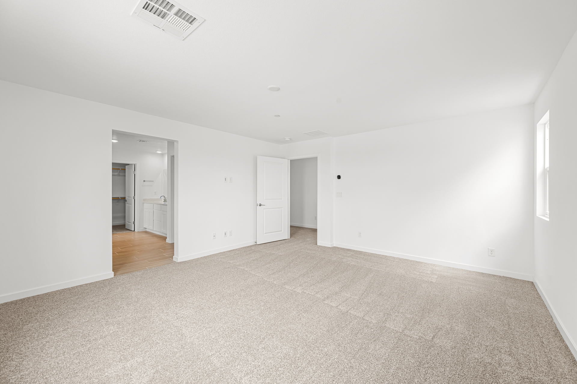 A hallway with white walls.