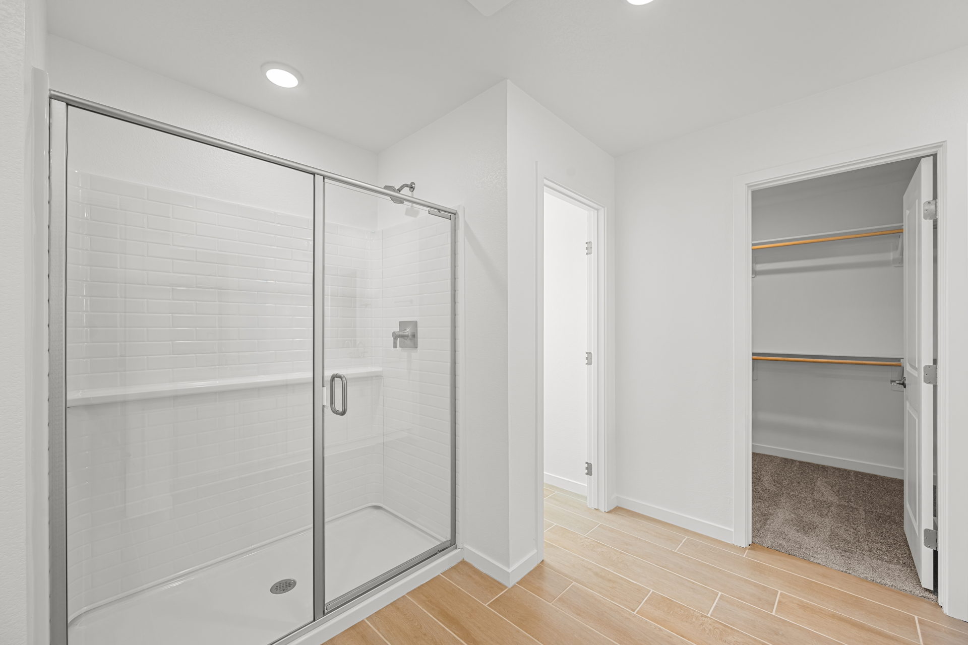 A bathroom with white doors.