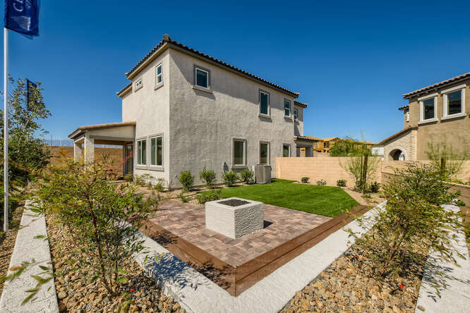 A house with a pool in the front yard.