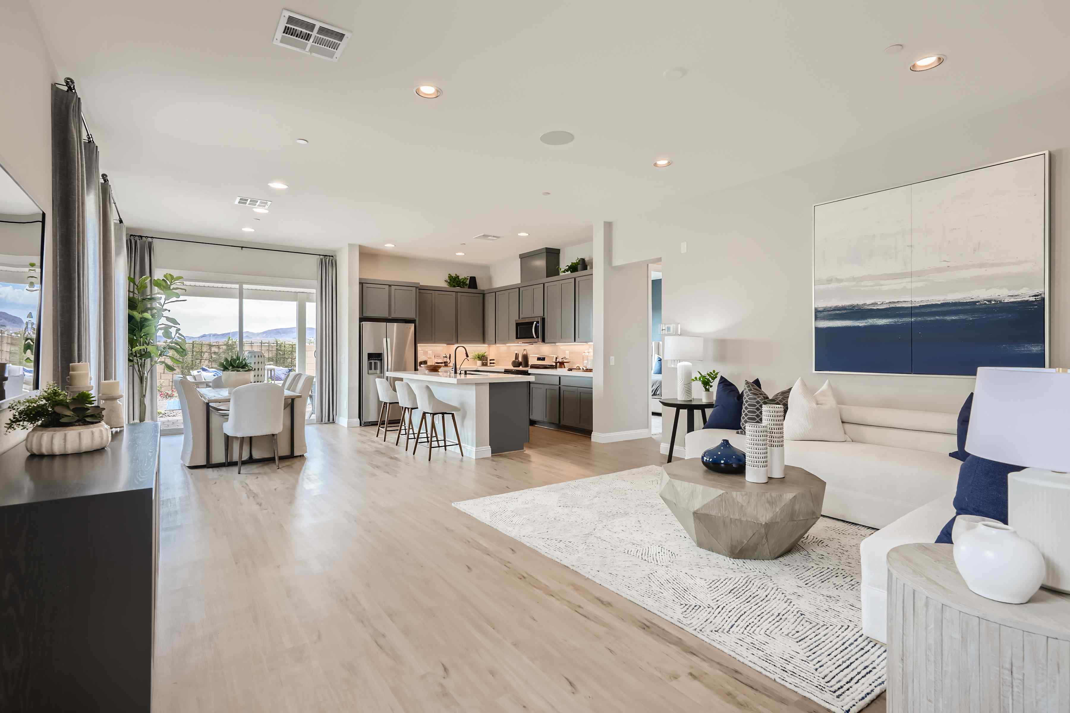 A large living room with a large window.