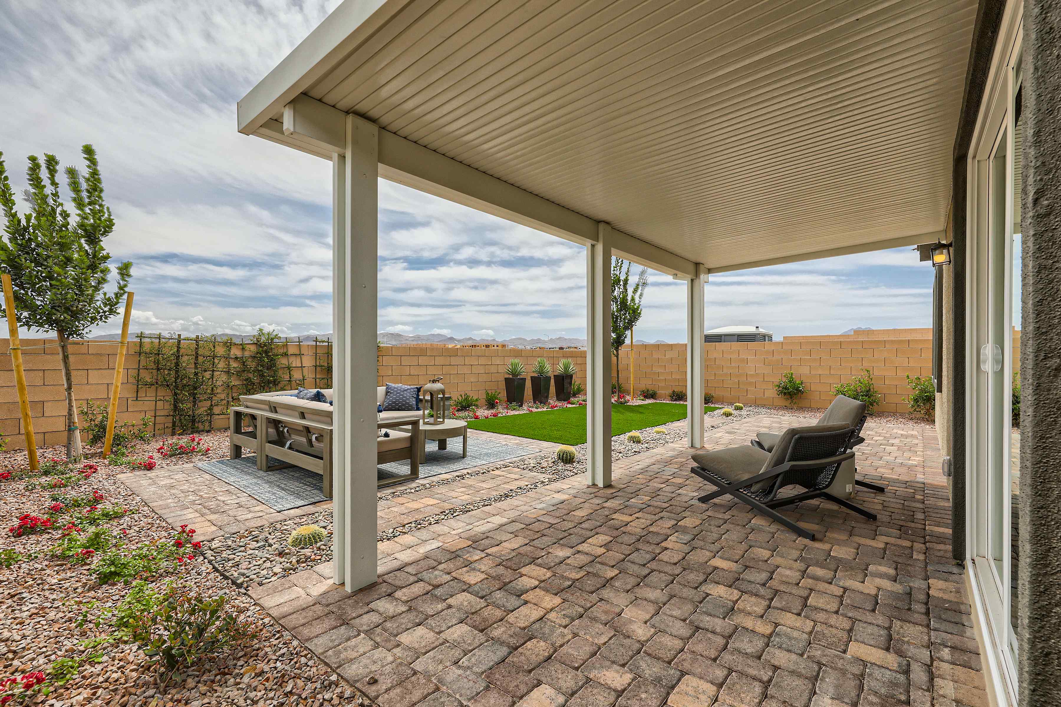 A patio with a table and chairs.