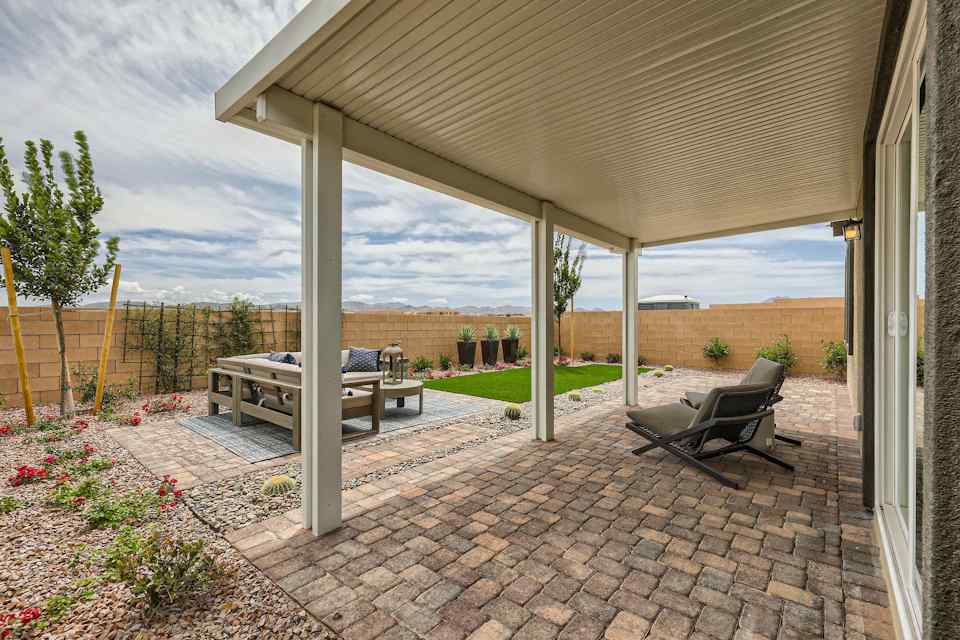 A patio with a table and chairs.