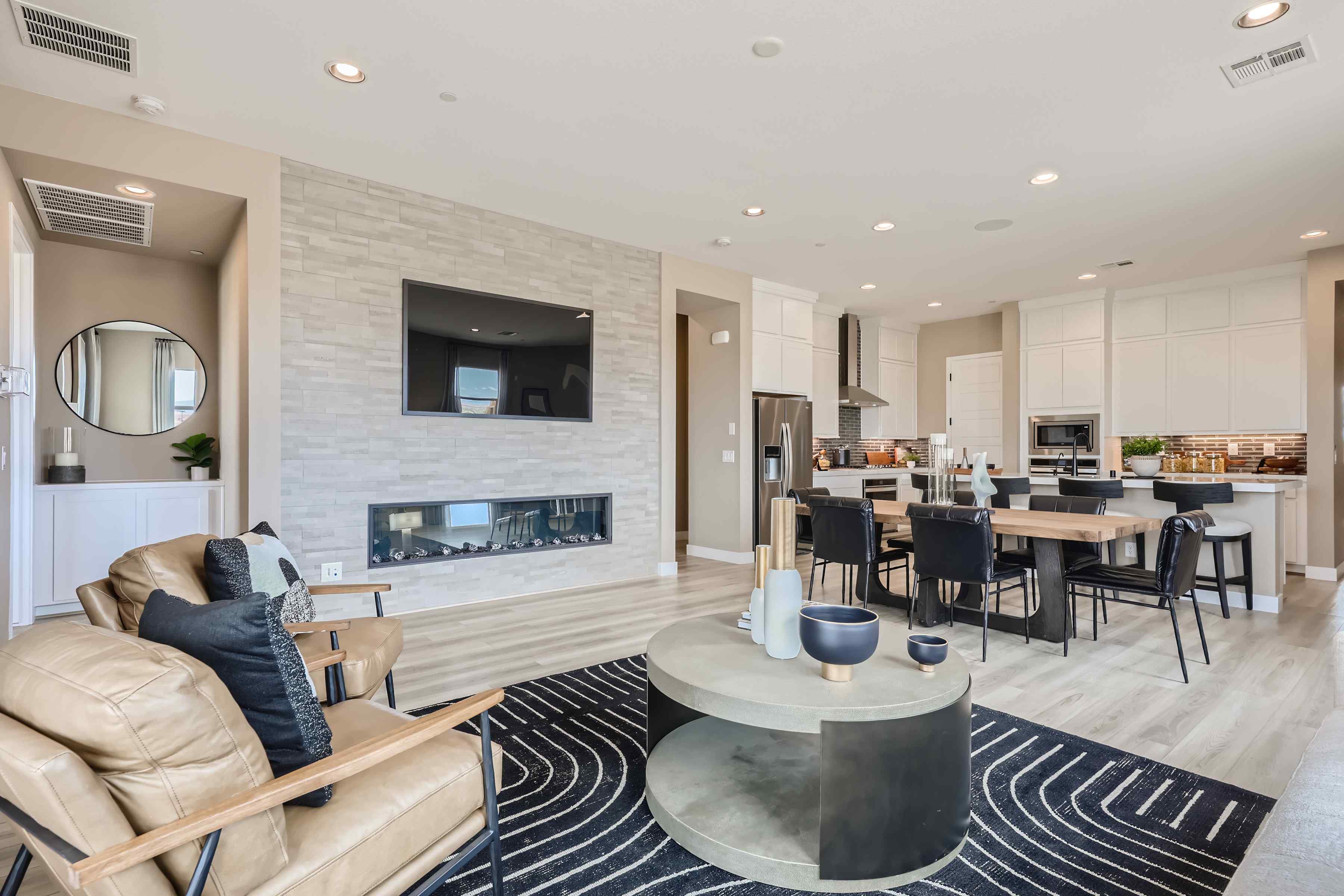A large living room with a fireplace.