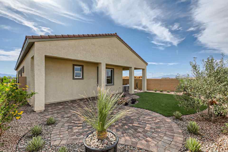 A house with a brick driveway.