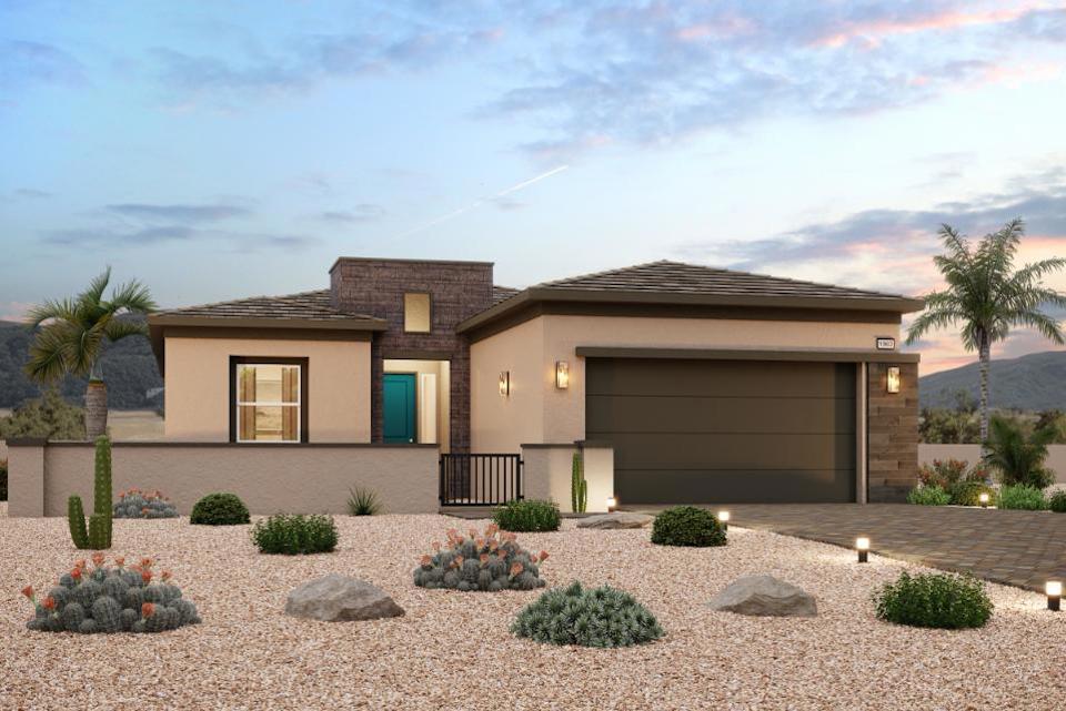 A house with a driveway and palm trees.