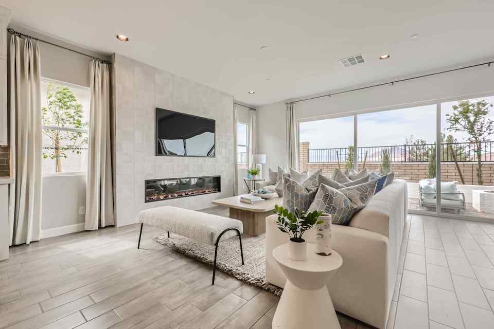 A living room with a fireplace.