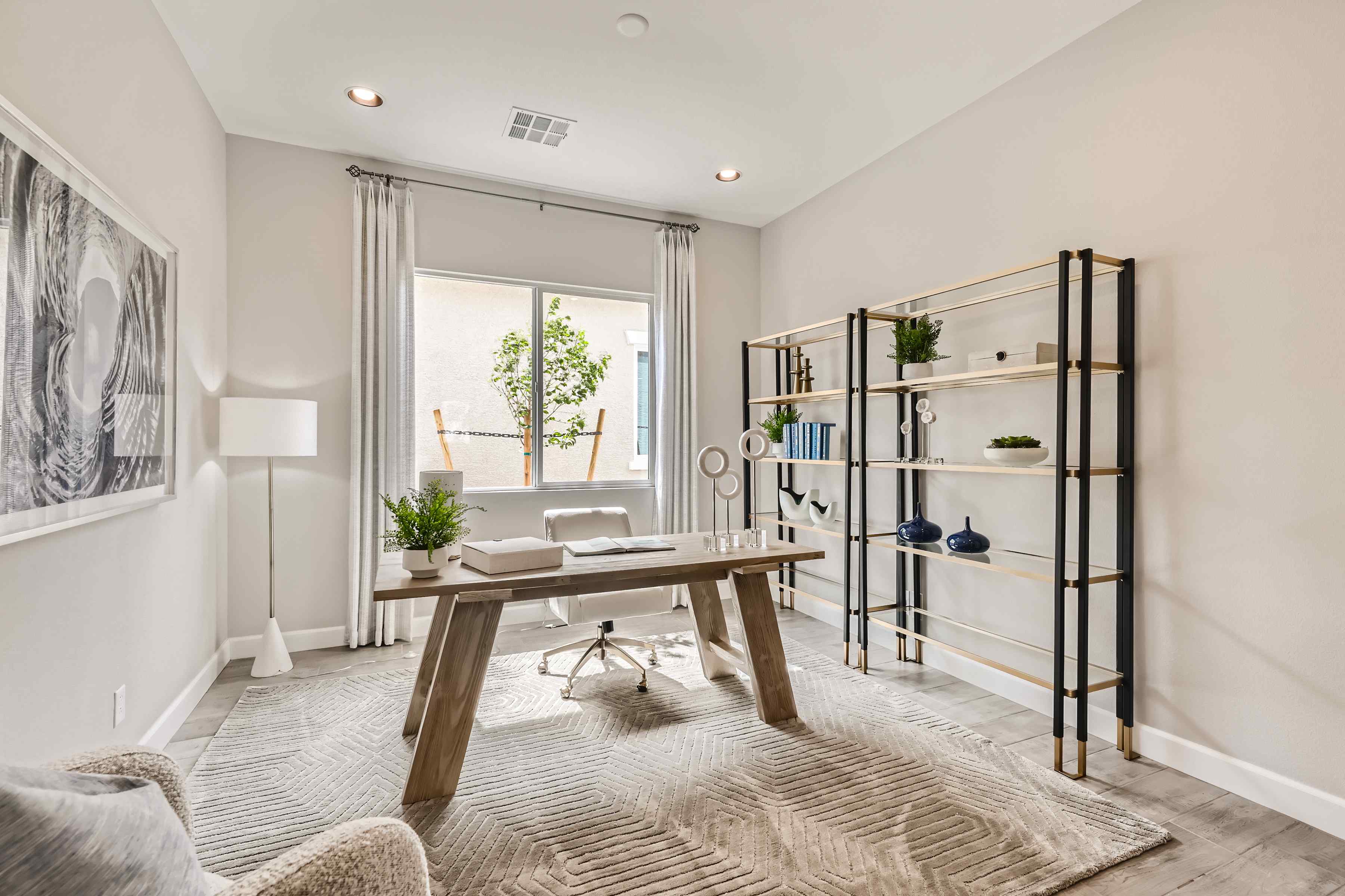 A room with a table and a shelf with objects on it.