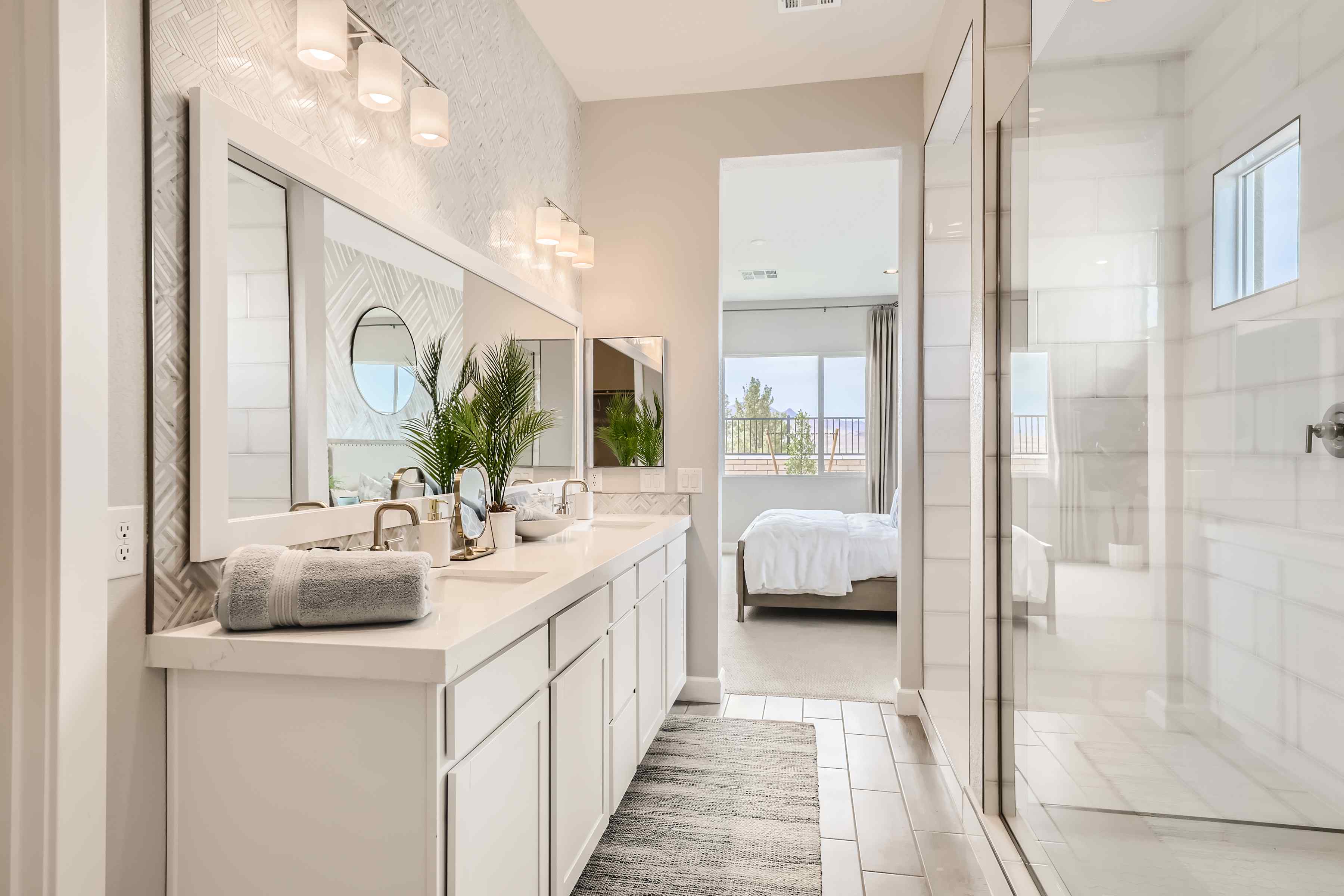 A bathroom with a large mirror.