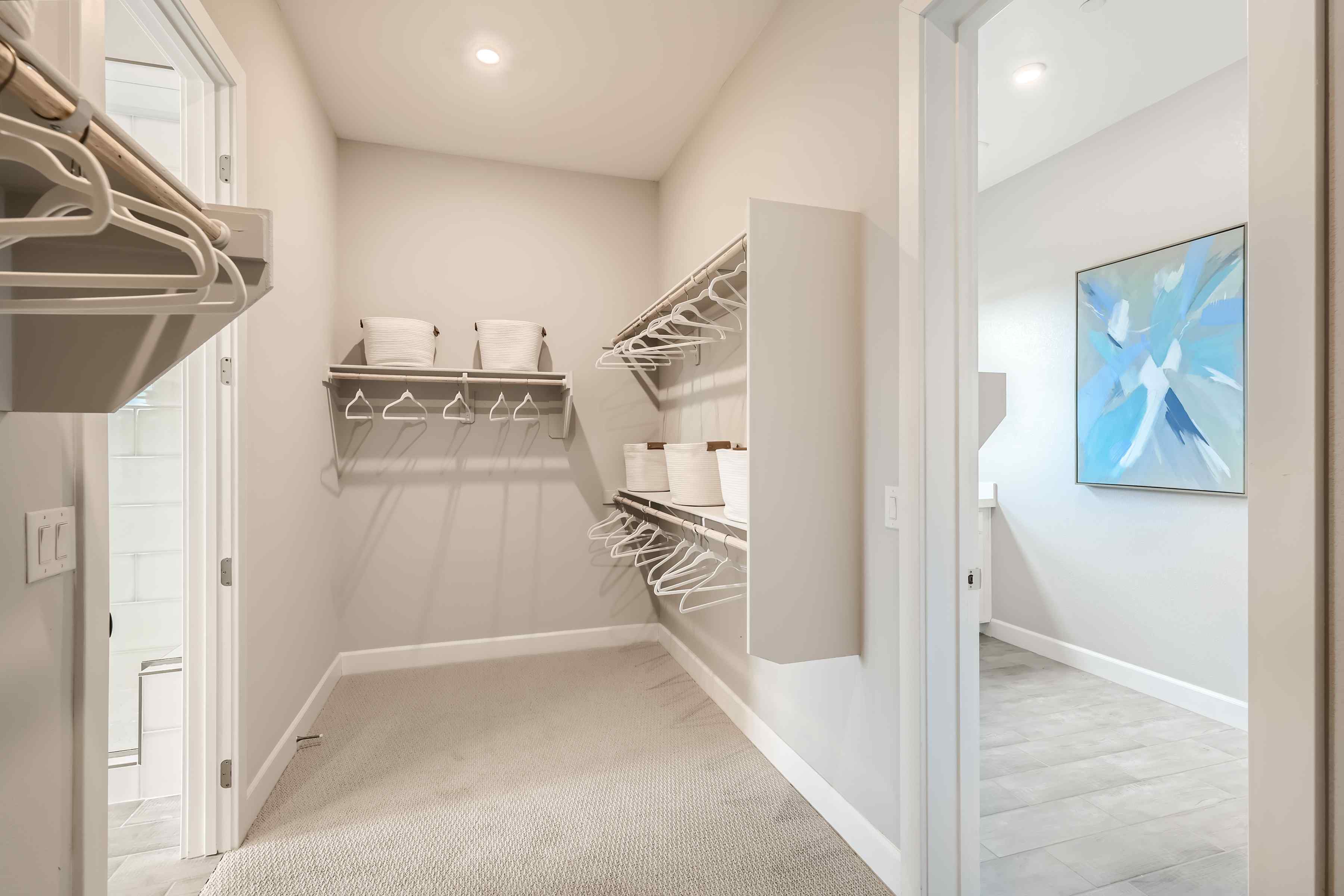 A room with a bed and a shelf.