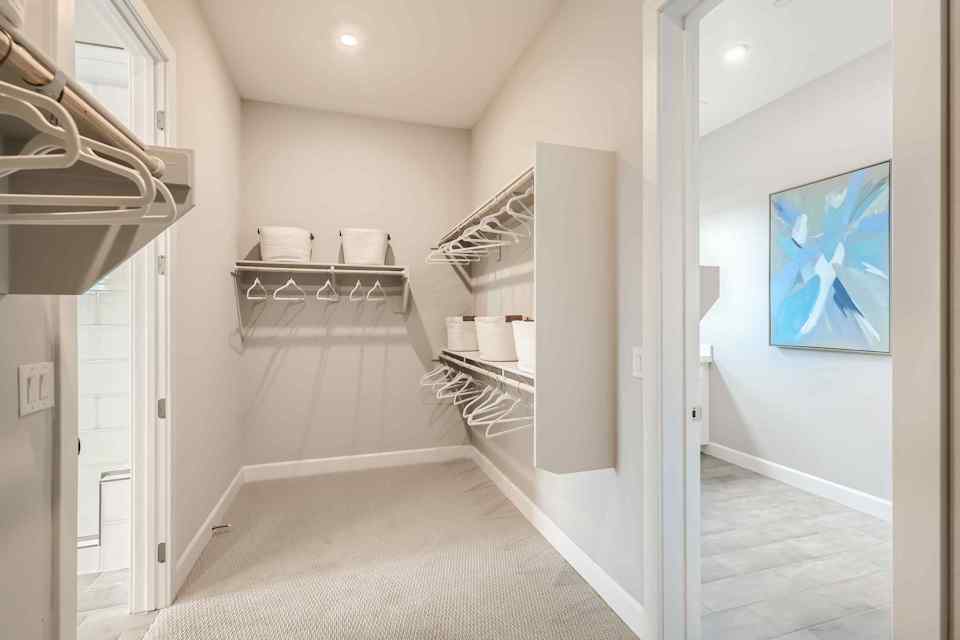 A room with a bed and a shelf.