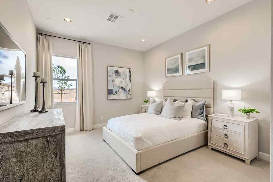 A bedroom with a large bed.