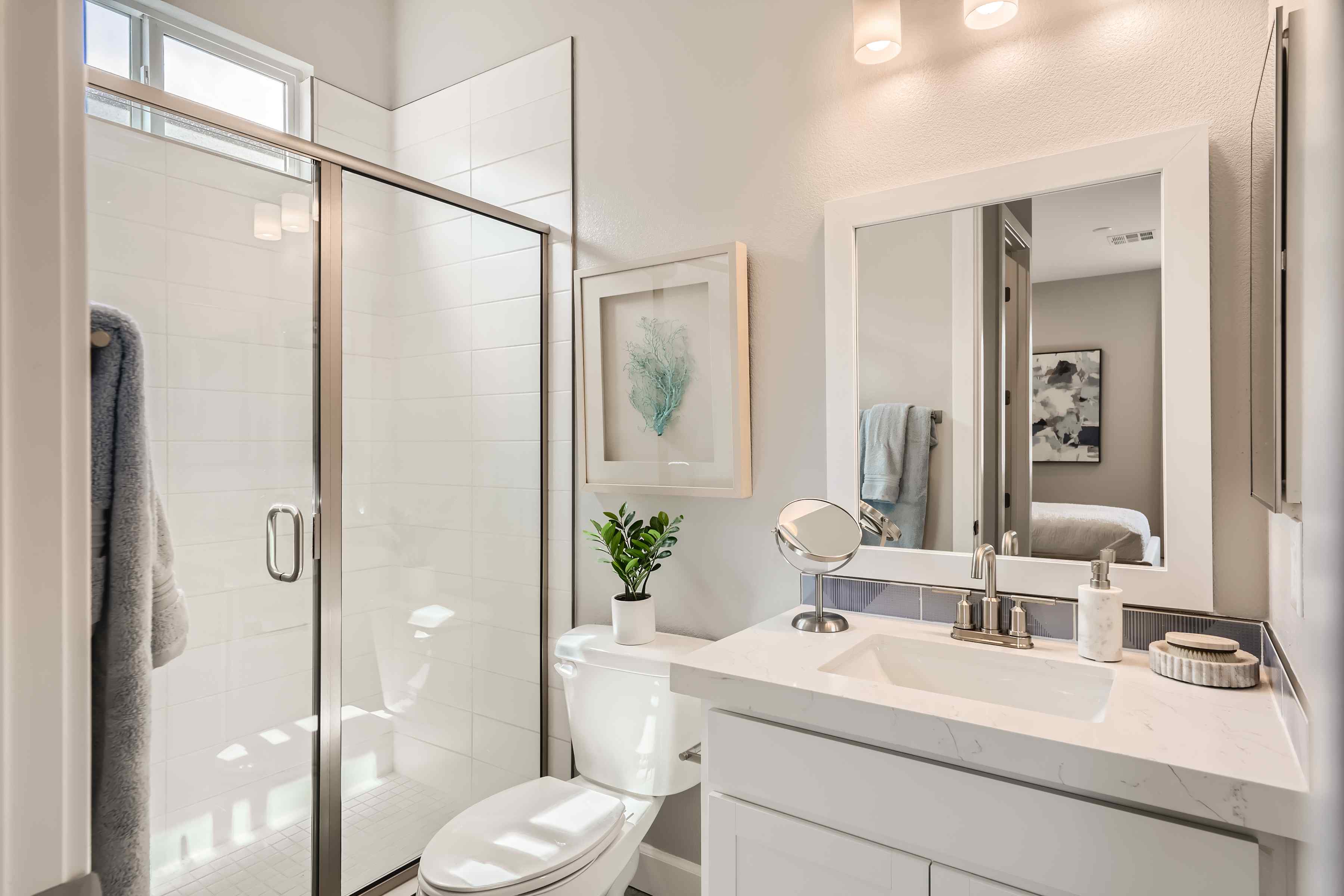 A bathroom with a glass shower.