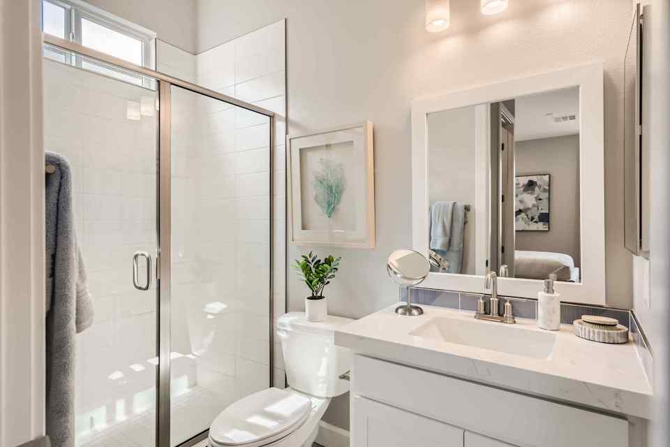 A bathroom with a glass shower.