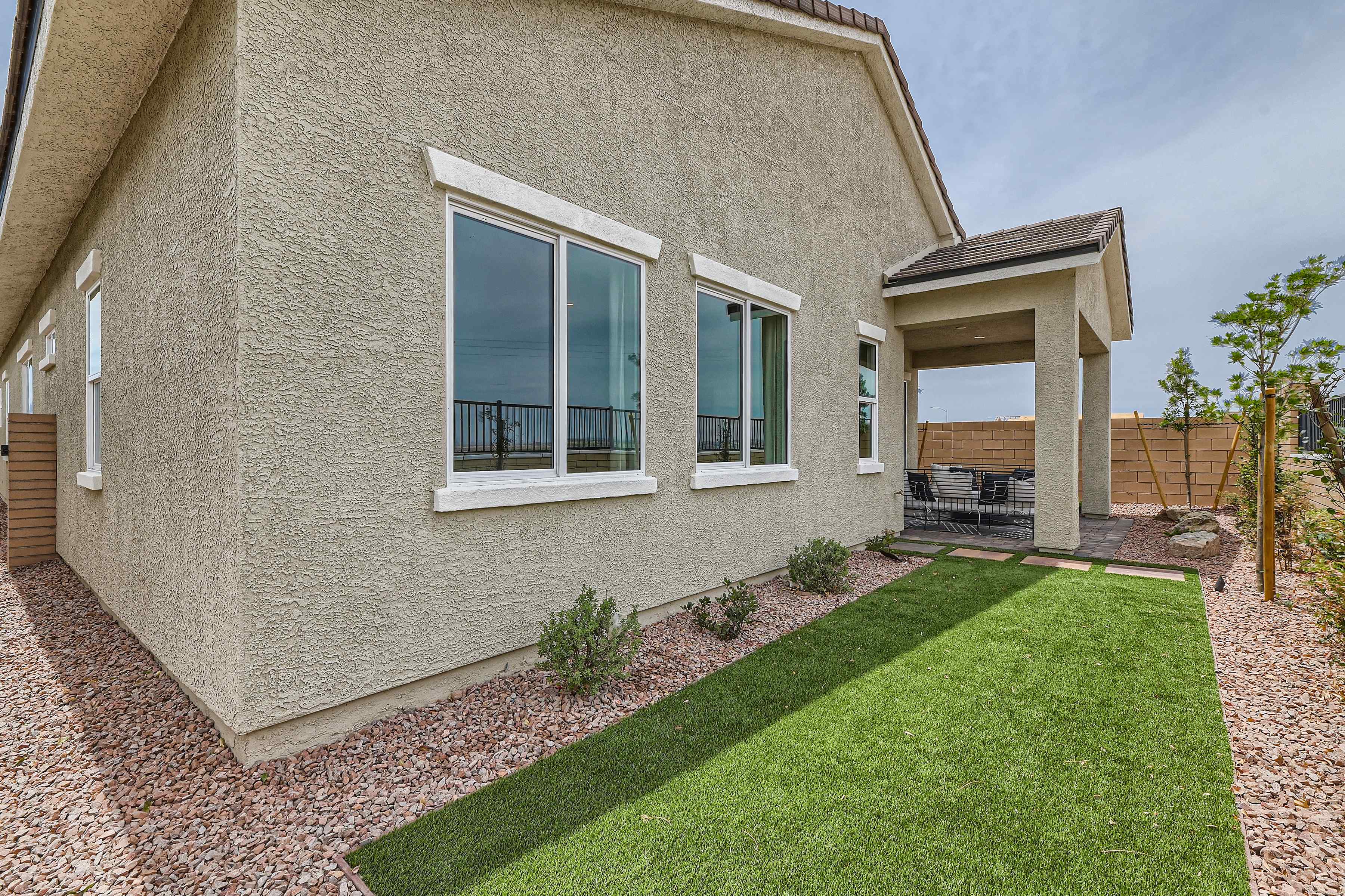 A house with a grass yard.