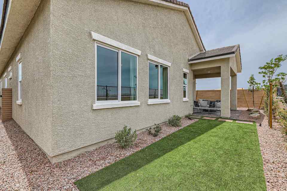 A house with a grass yard.