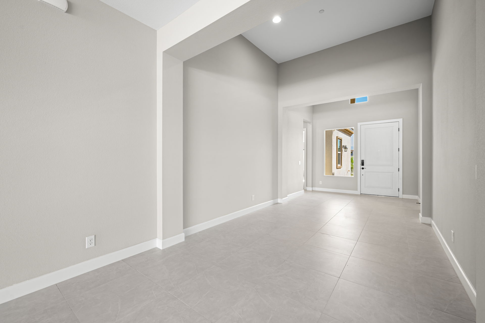 A hallway with white walls.