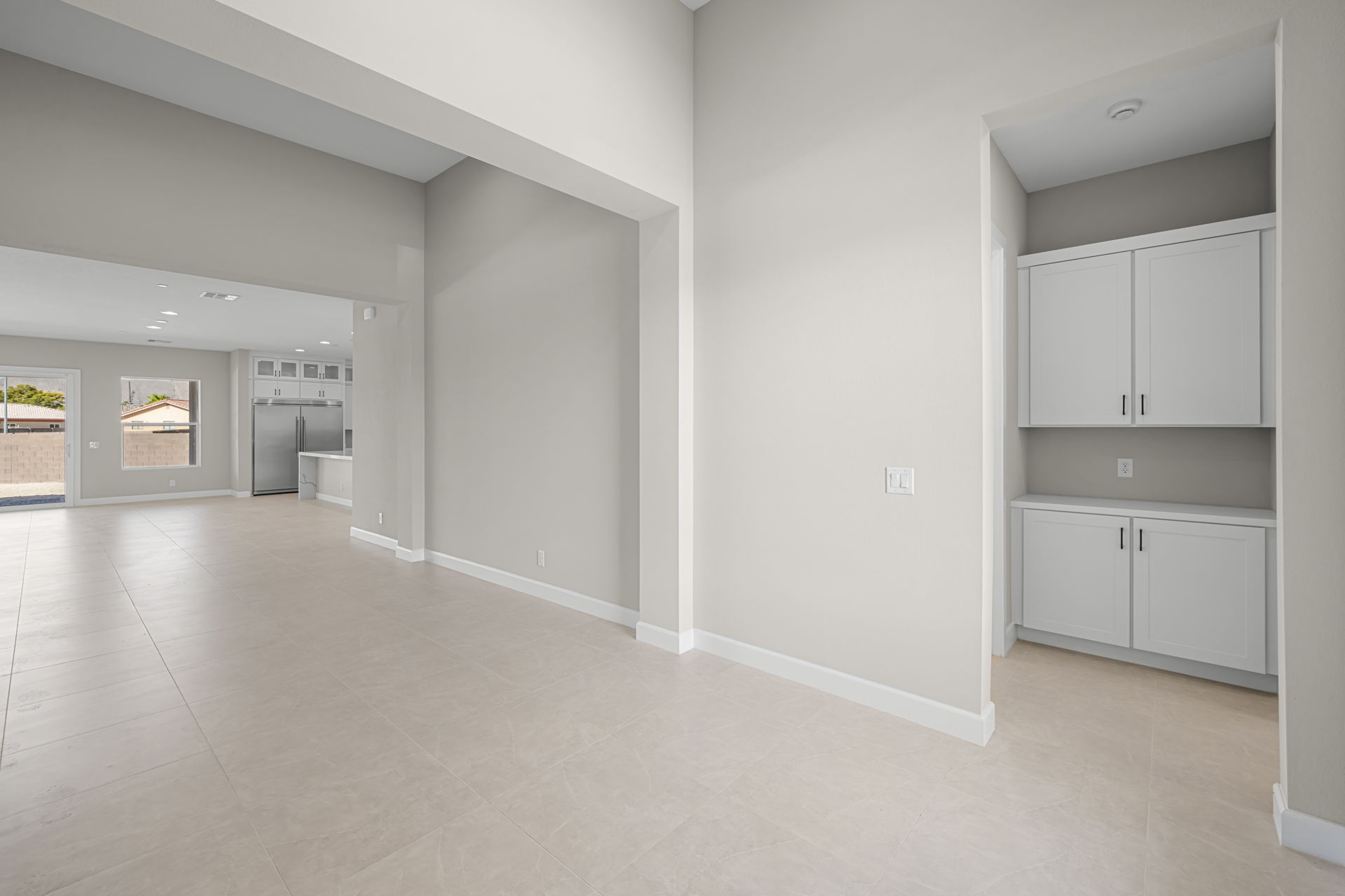 A large white room with white cabinets.