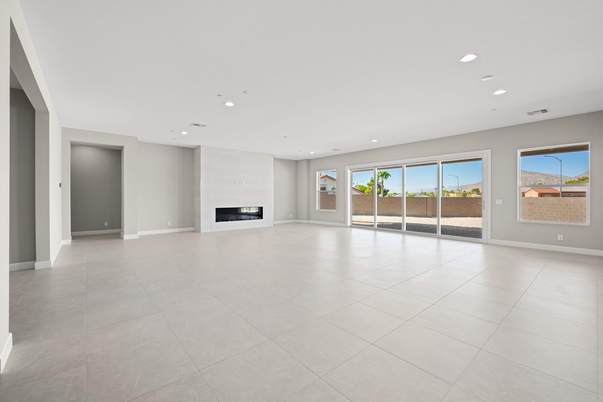 A large empty room with glass doors.
