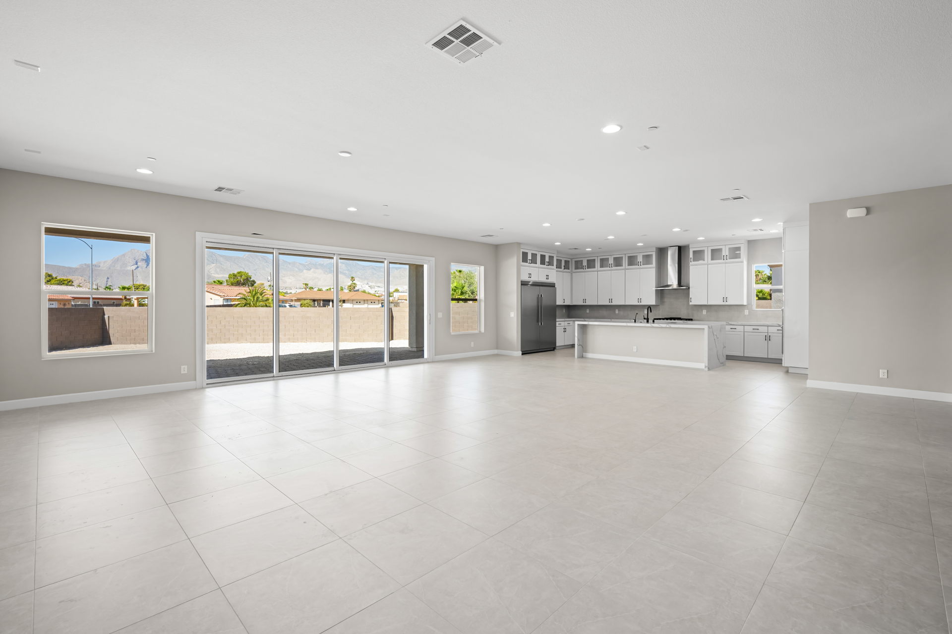 A large white room with glass doors.