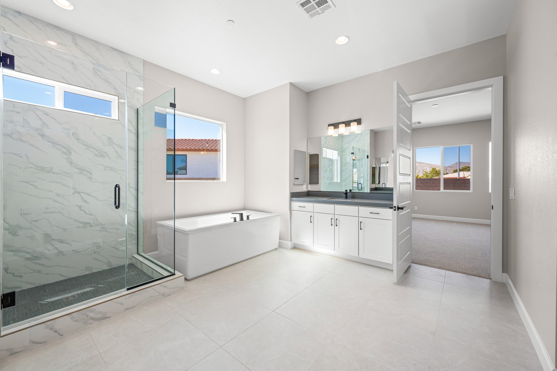 A bathroom with a large glass shower.