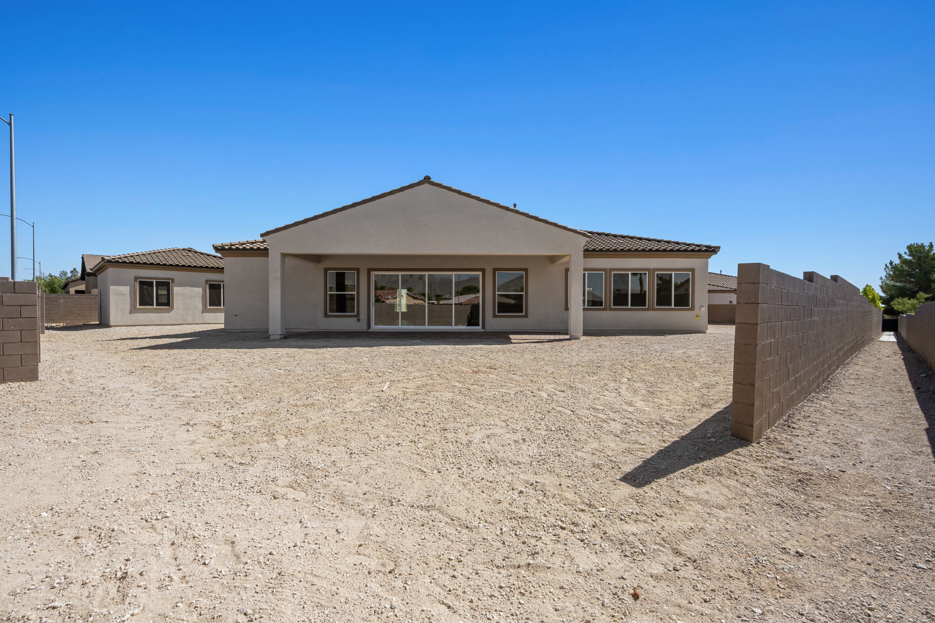 A house with a dirt yard.