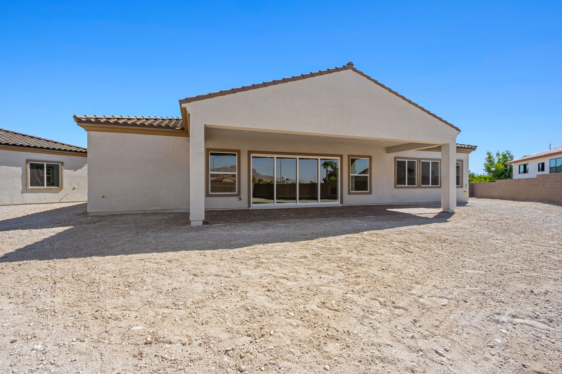 A house with a gravel yard.