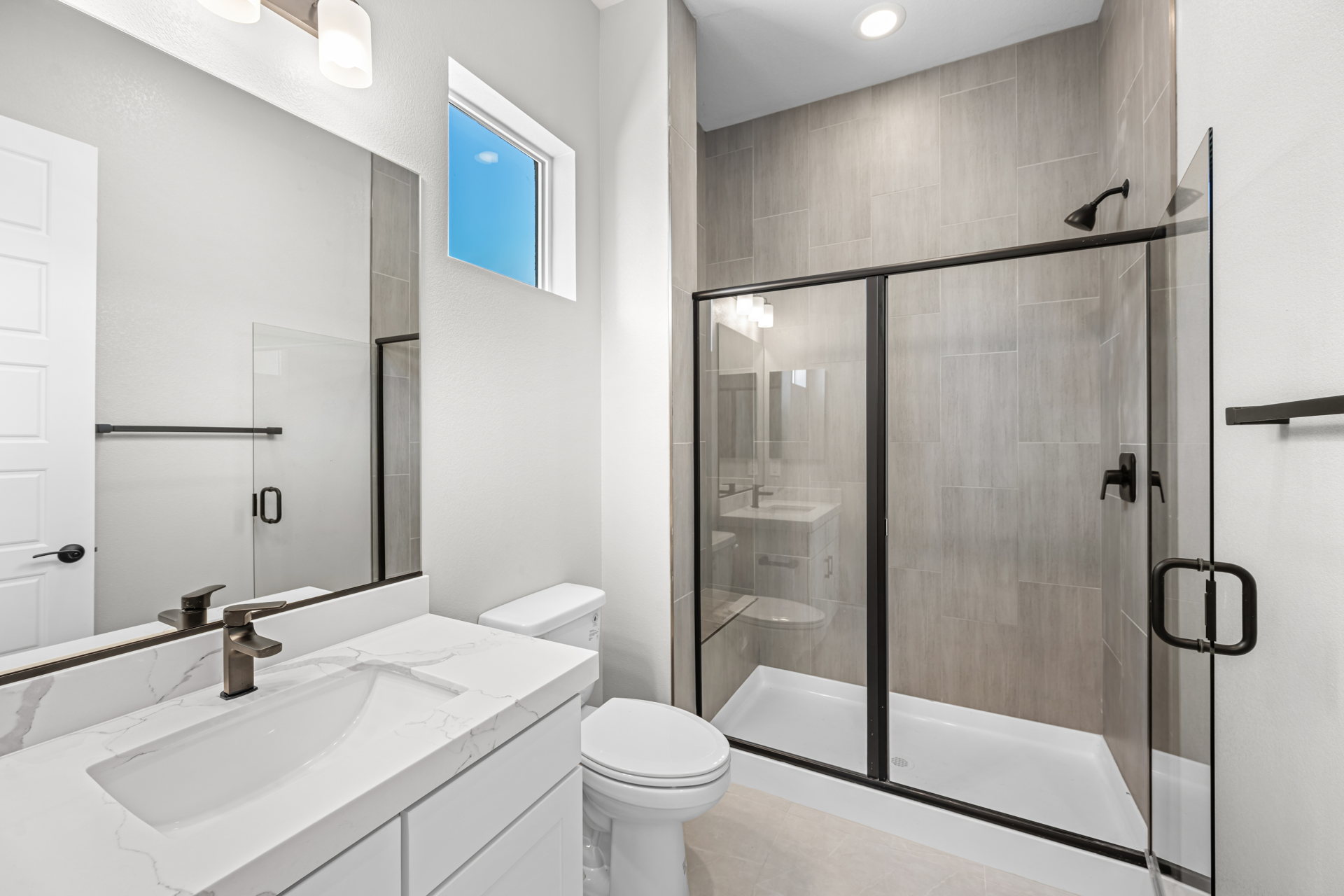 A bathroom with a glass shower.