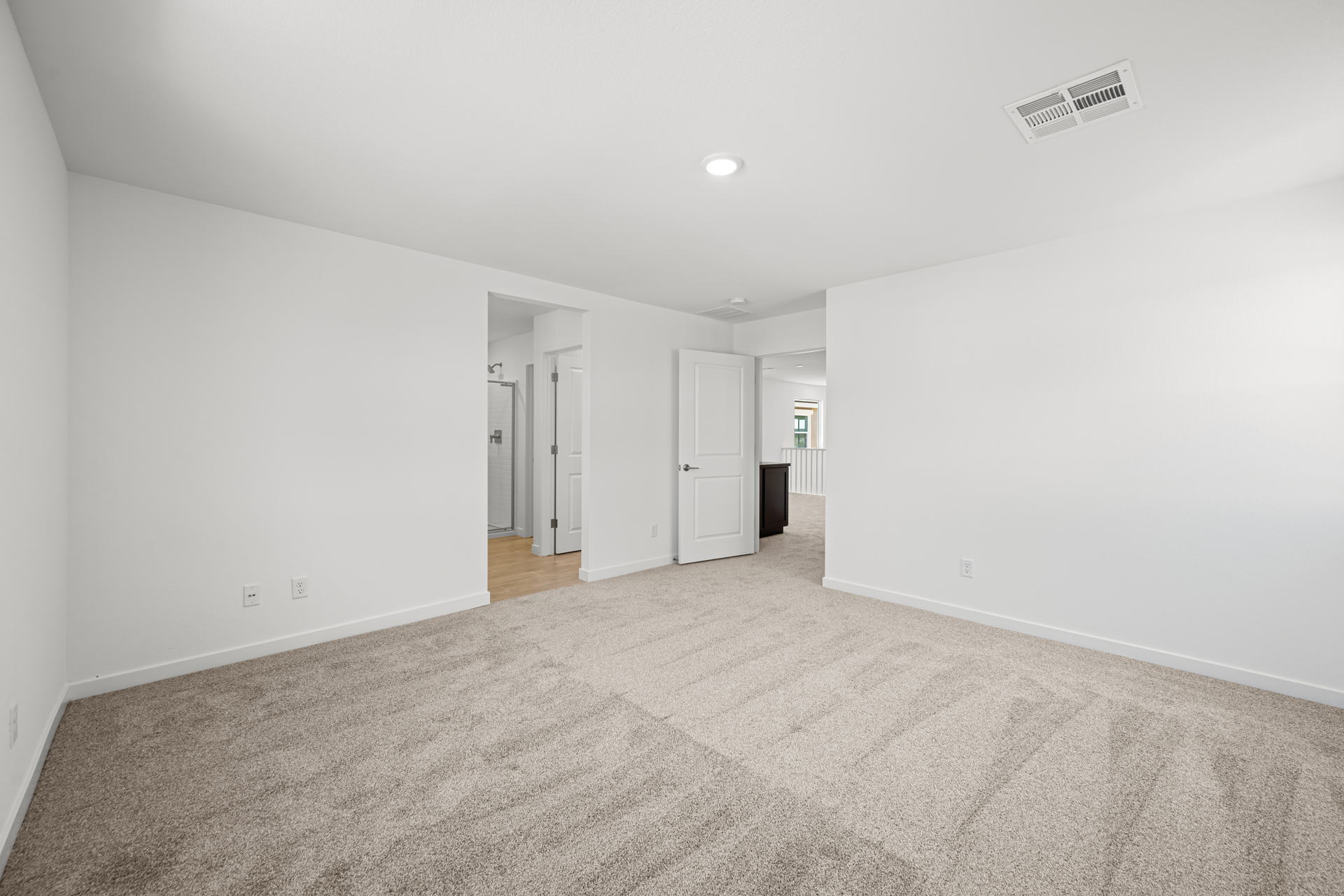 A long hallway with white walls.