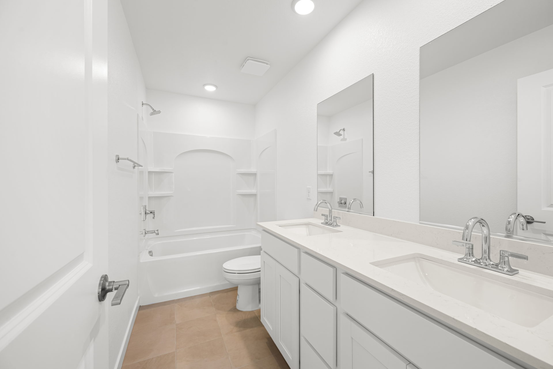 A bathroom with a tub sink and toilet.